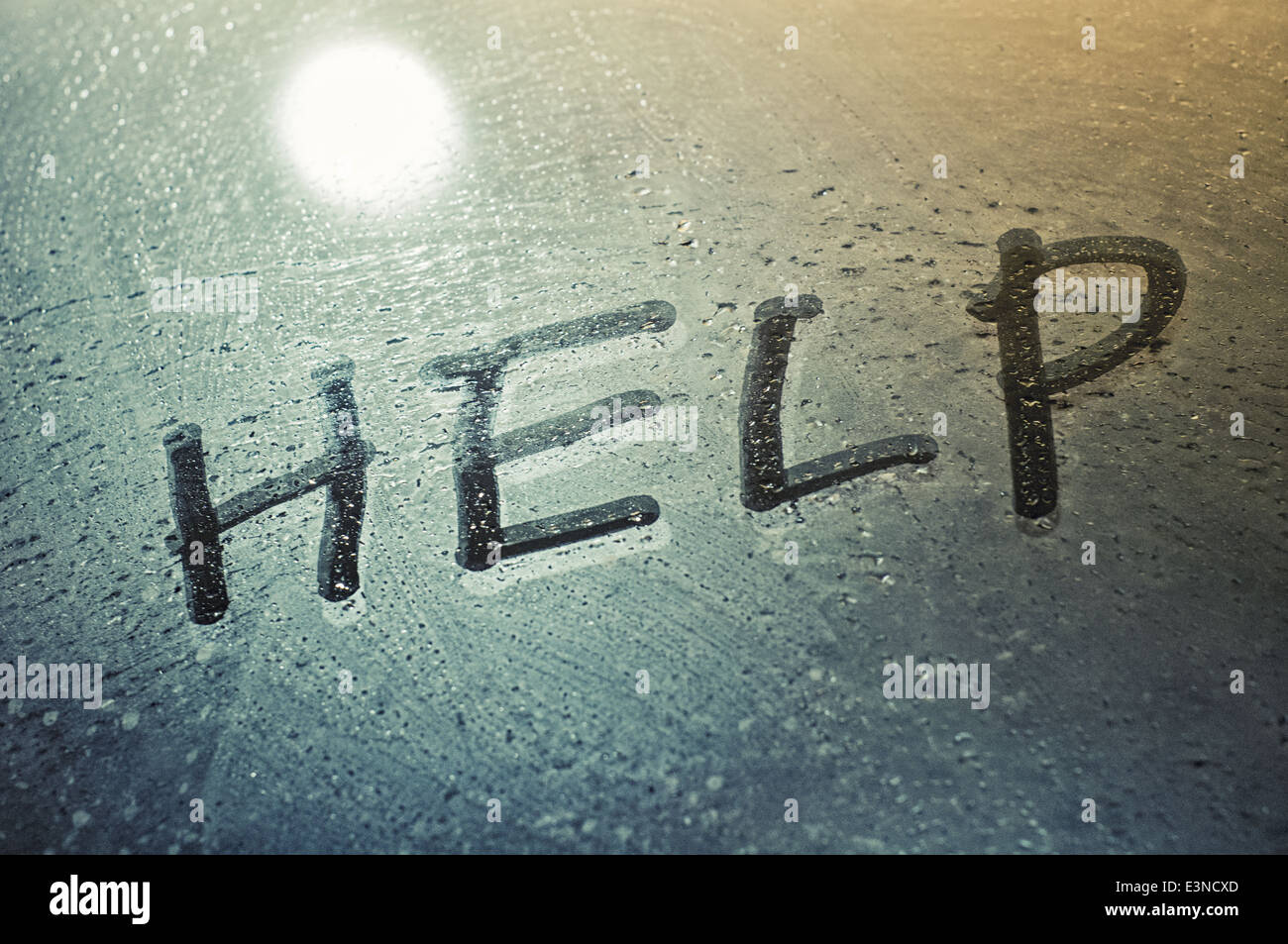 Help message on moist glass for suspense concepts. Stock Photo