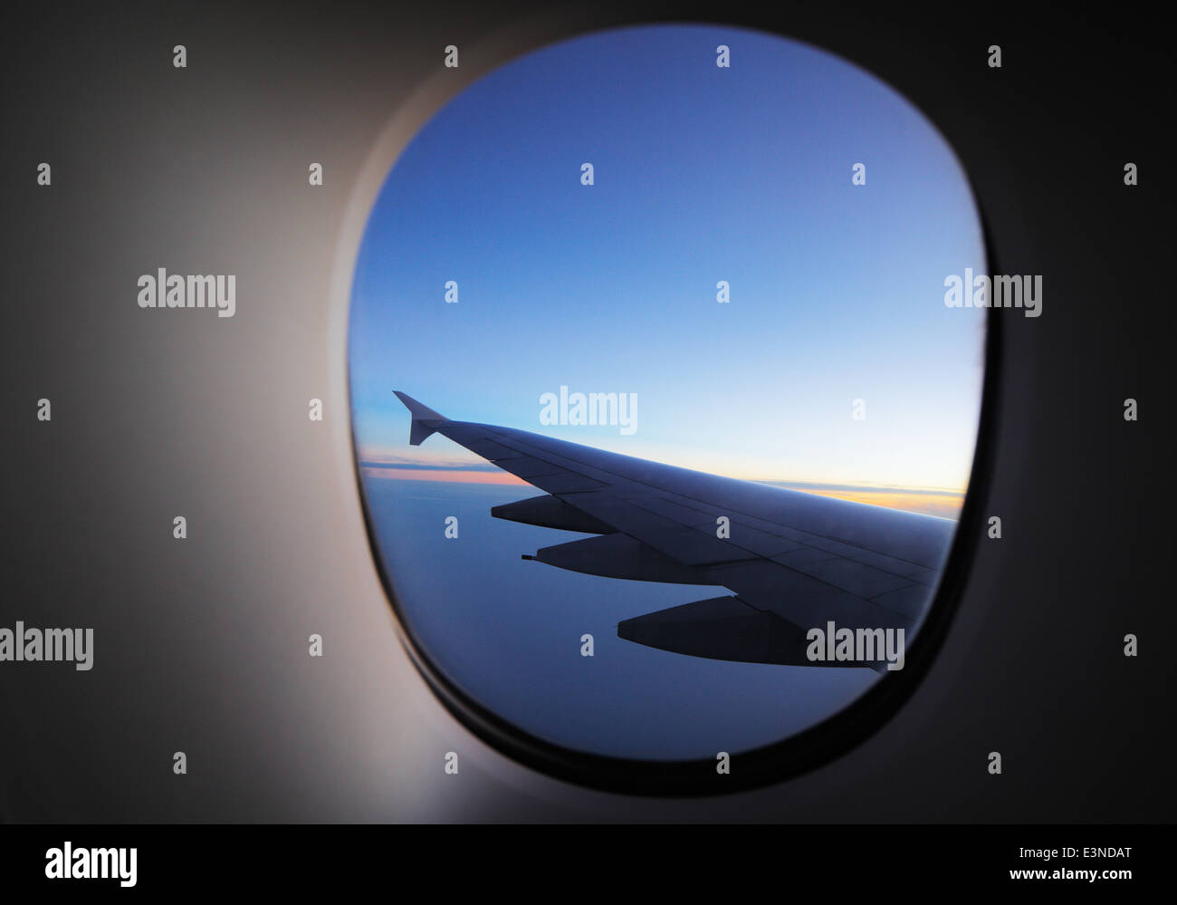 A window view of the wing of a modern luxury jet plane Stock Photo - Alamy