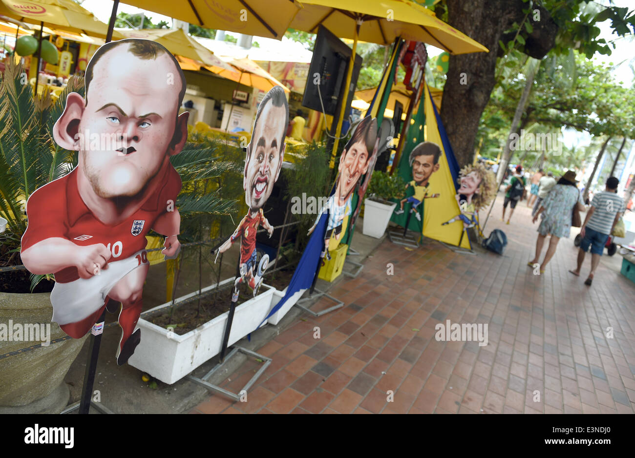 Fortaleza, Brazil. 20th June, 2014. Caricatures of England's Wayne Rooney (L-R) and Spain's Andres Iniesta are seen next to Argentina's Lionel Messi, Brazil's Neymar and David Luiz at a street bar in Fortaleza, Brazil, 20 June 2014. The FIFA World Cup will take place in Brazil from 12 June to 13 July 2014. Photo: Marcus Brandt/dpa/Alamy Live News Stock Photo