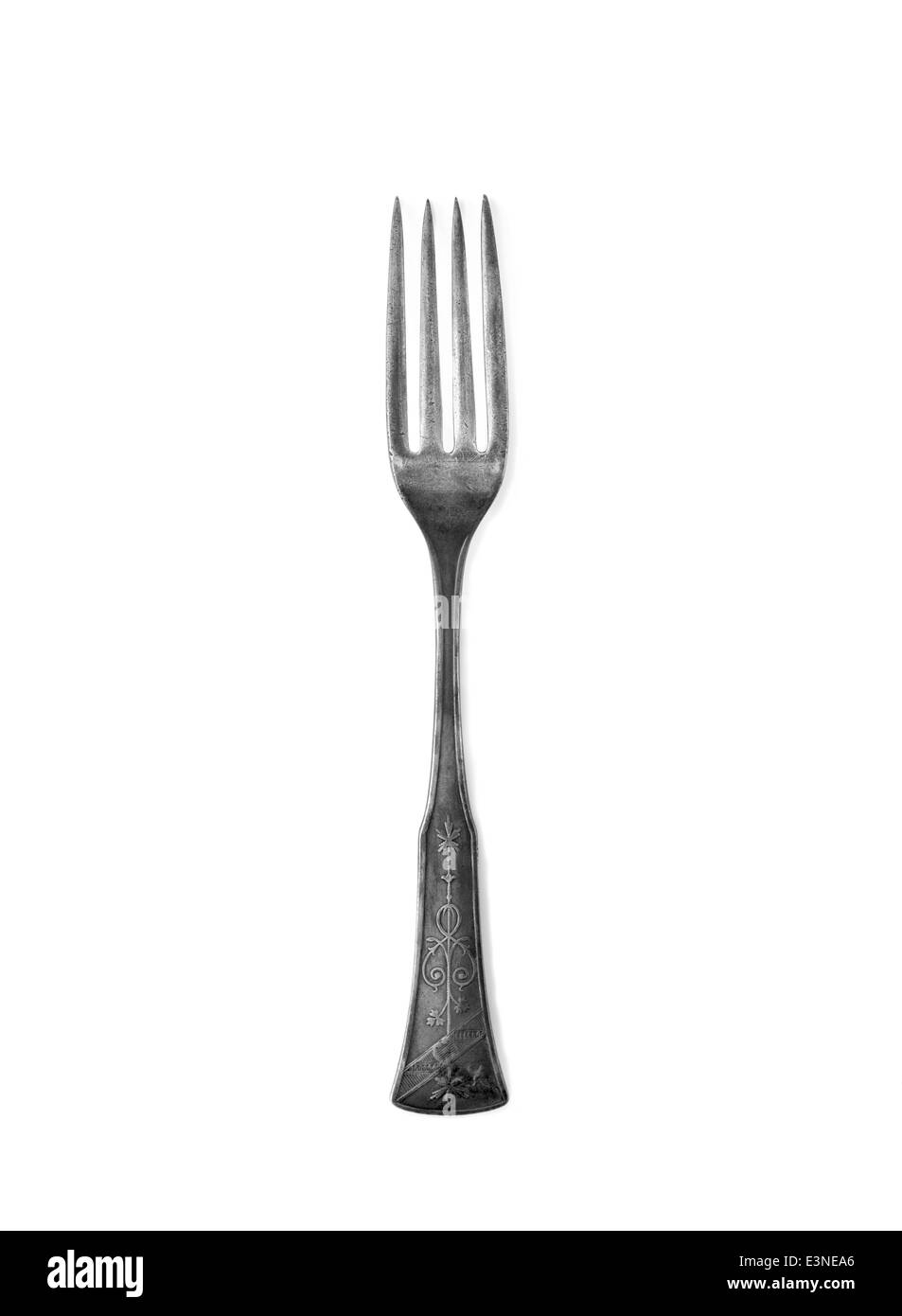 Old vintage kitchen fork on a white background Stock Photo