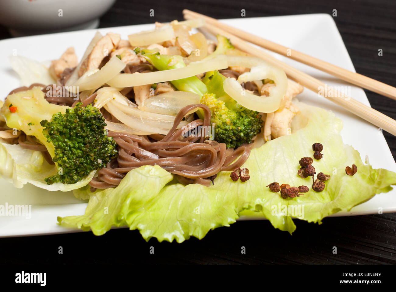 Stir fry chicken with broccoli and buckwheat soba noodles Stock Photo
