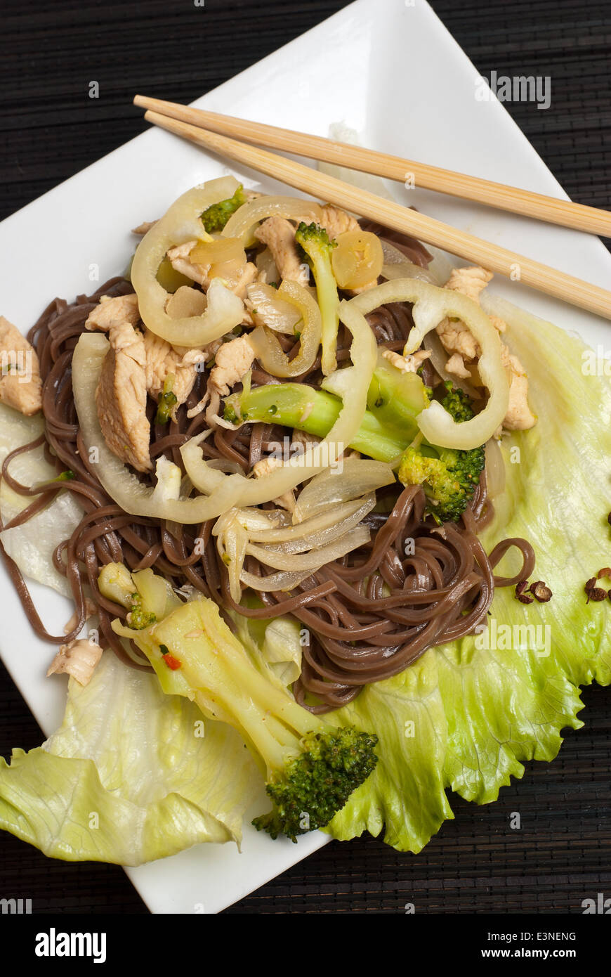 Stir fry chicken with broccoli and buckwheat soba noodles Stock Photo