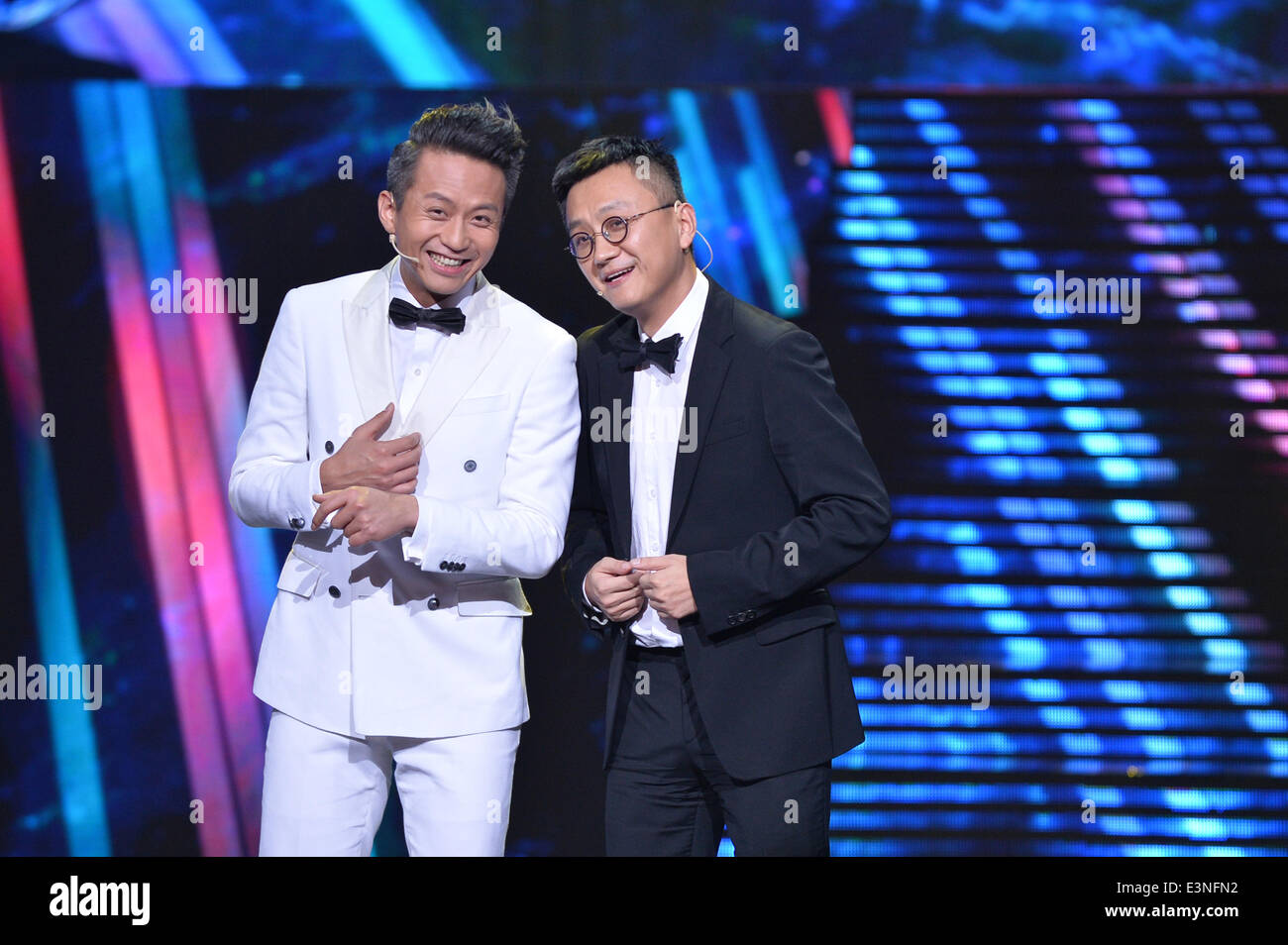 Beijing, China. 25th June, 2014. Director Deng Chao (L) and scriptwriter Yu Baimei talk about their new movie during China Film New Power Commendation Ceremony in Beijing, capital of China, June 25, 2014. Ten young directors brought their new works to the ceremony. © Li Xin/Xinhua/Alamy Live News Stock Photo