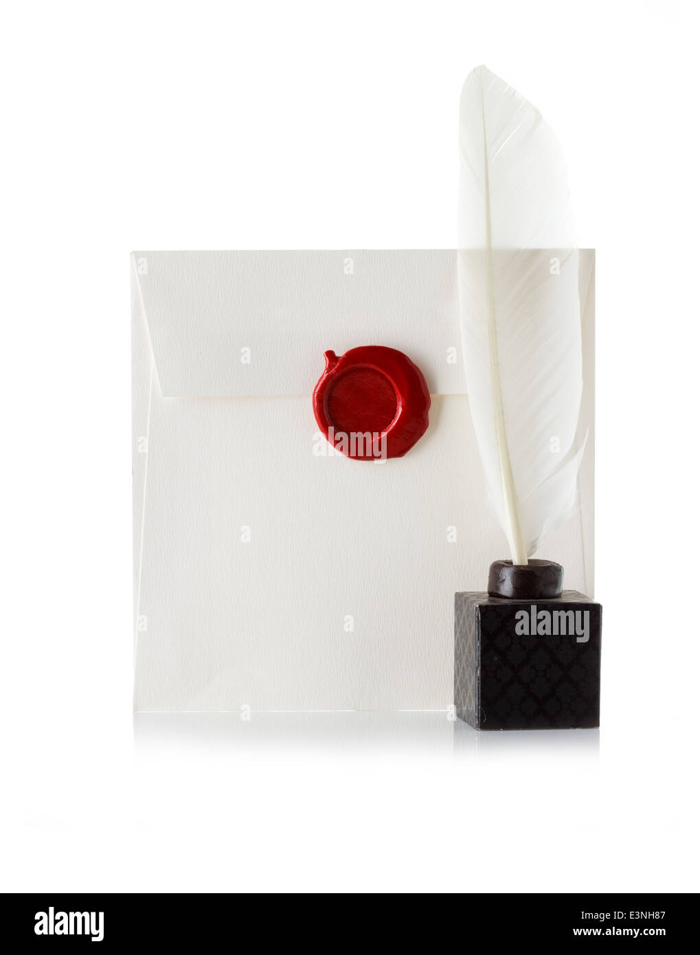 mail envelope or letter sealed with wax seal stamp and quill pen isolated on white Stock Photo
