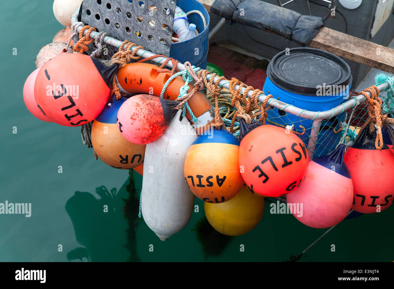 Buoys on the back of fishing boat St Peter Port Guernsey Stock Photo