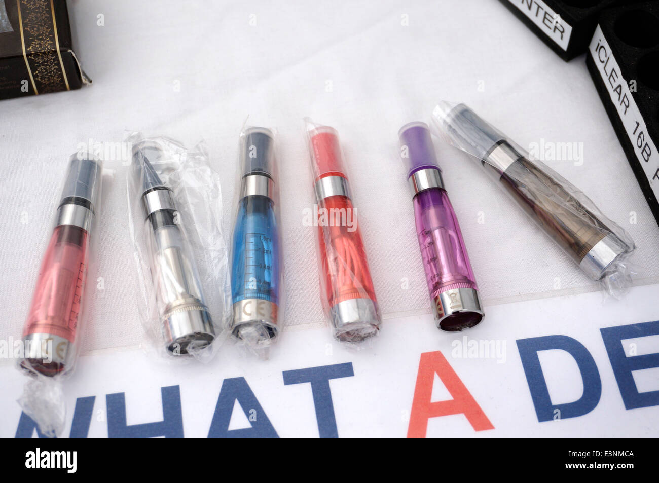 Electronic disposable E Cigarette (e-cigarette) items for sale on a Market Stall to help give up smoking Stock Photo