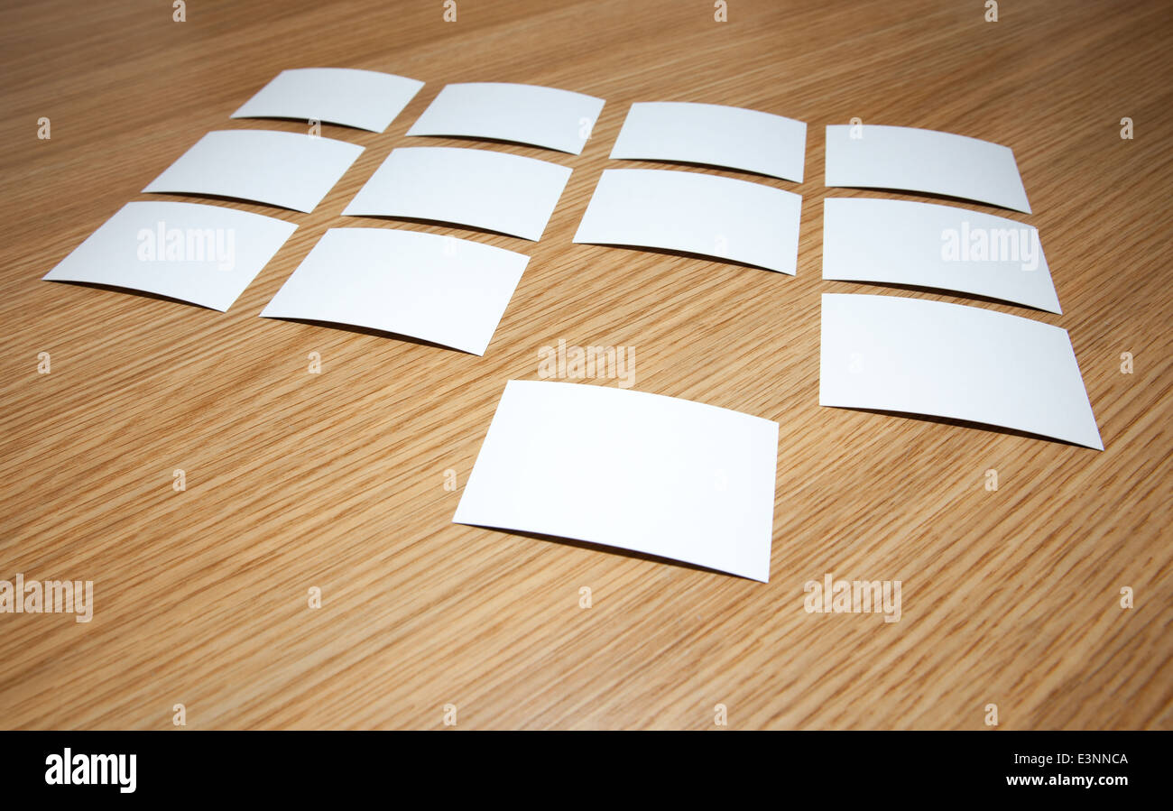 Many business cards on a wooden desk Stock Photo