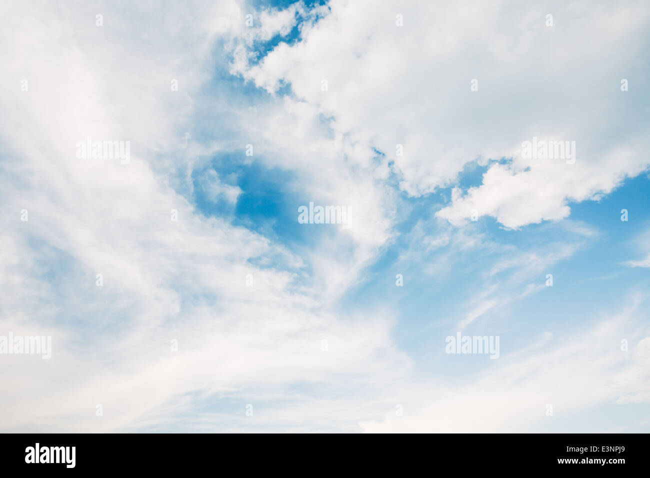 blue sky background with white fluffy clouds Stock Photo - Alamy