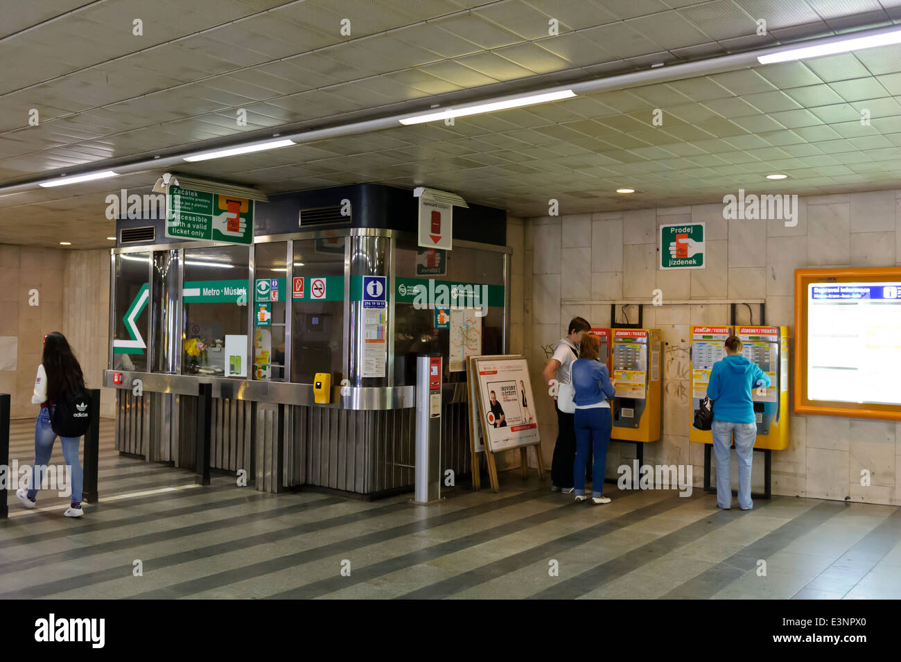 Commuters buying Metro tickets from ticket machines, Prague, Czech