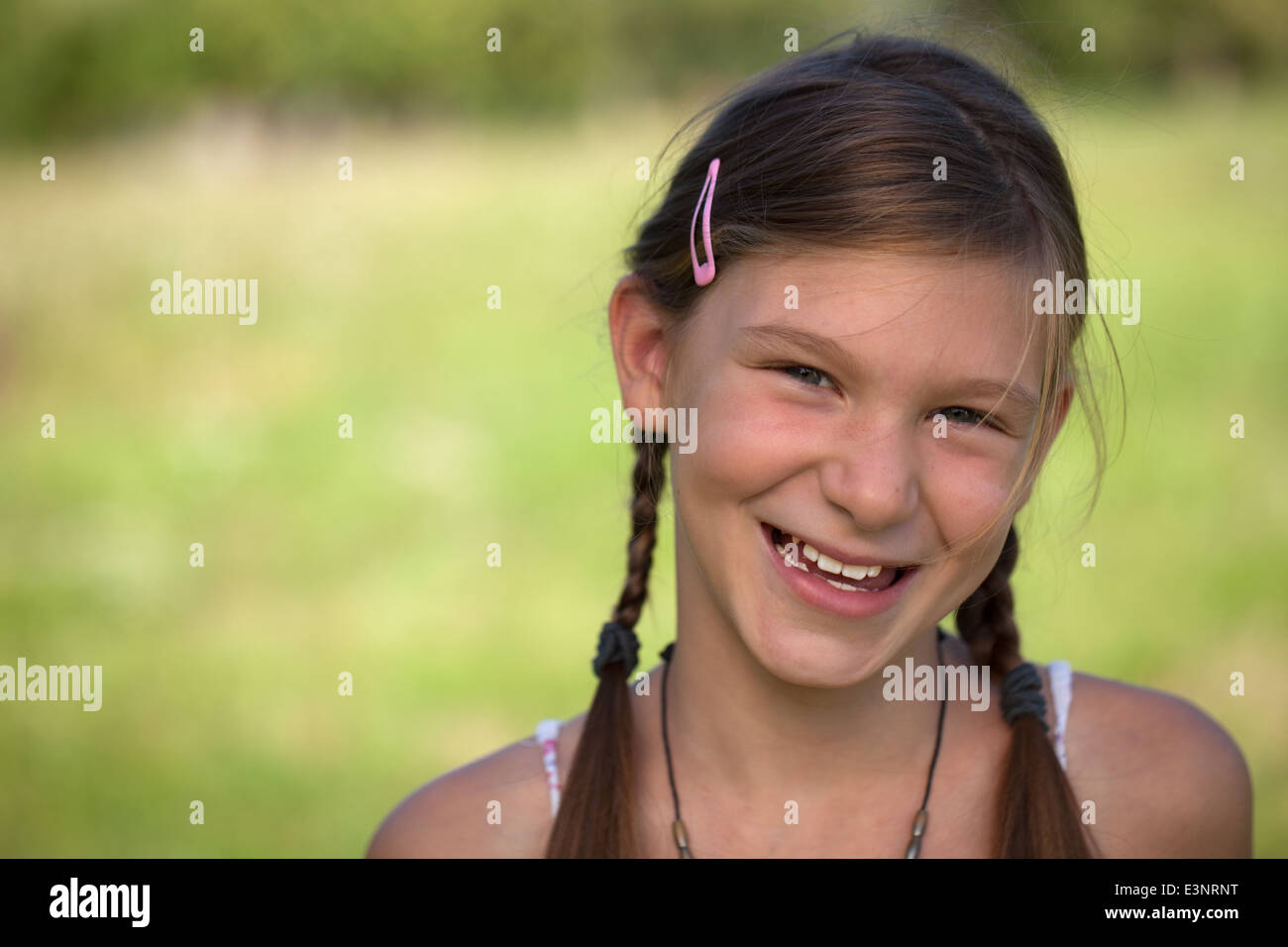 Portrait of a happy smiling young girl with copy space Stock Photo - Alamy