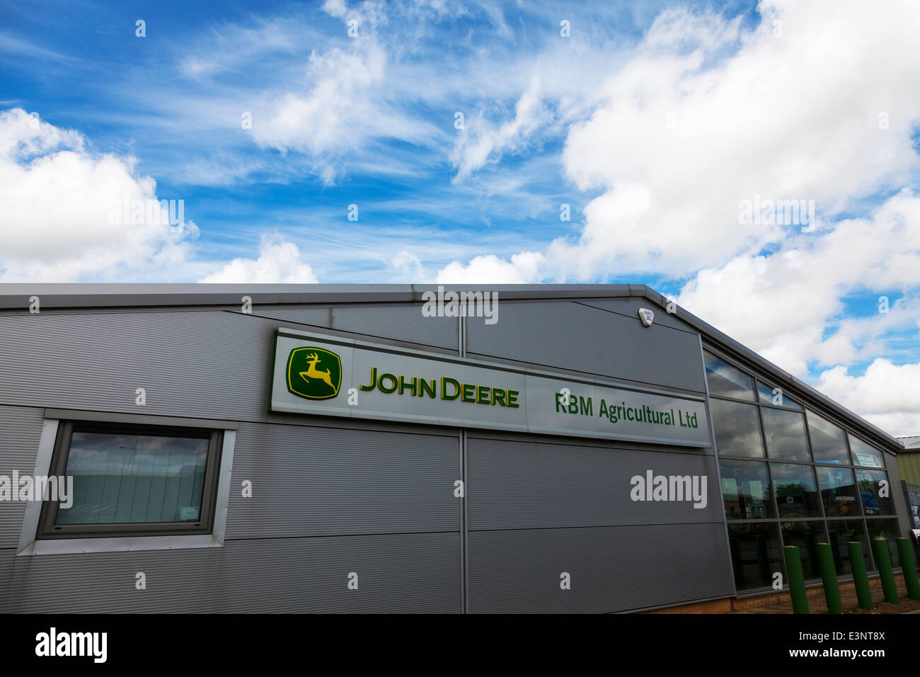 John Deere Logo Sign On A Retail Storefront Stock Photo - Download