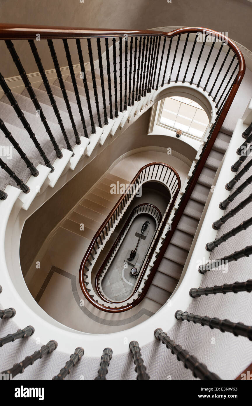 View looking down six flights of an eliptical staircase Stock Photo