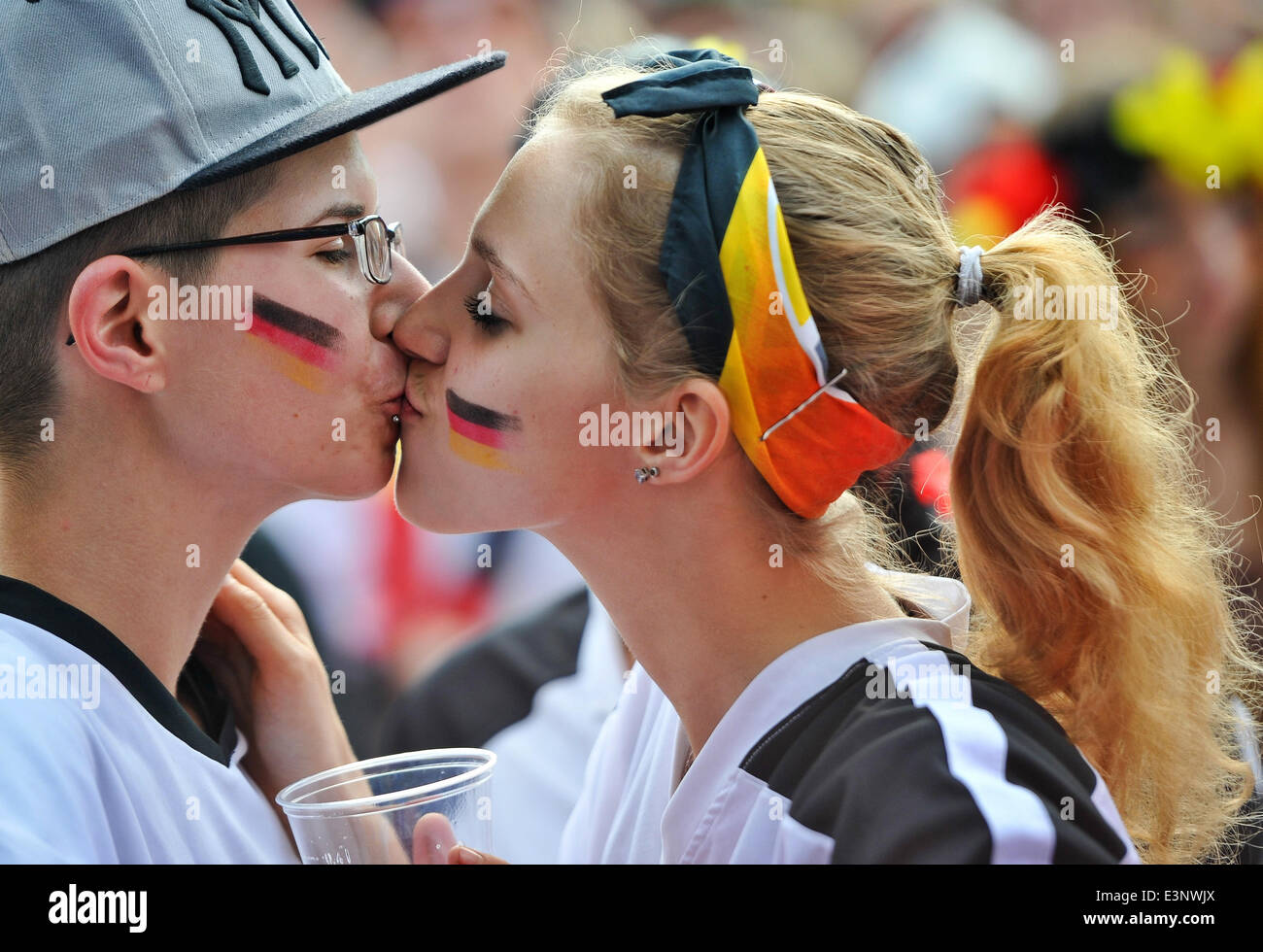 Fans kiss at the public screening of the FIFA World Cup 2014 match between  Germany and