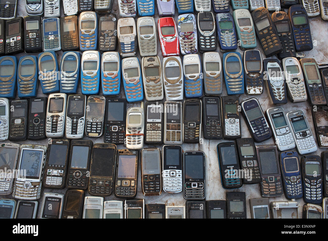 Old used mobile phones (cellphones) mostly Nokia for sale at the flea market in Ahmedabad, India. Stock Photo