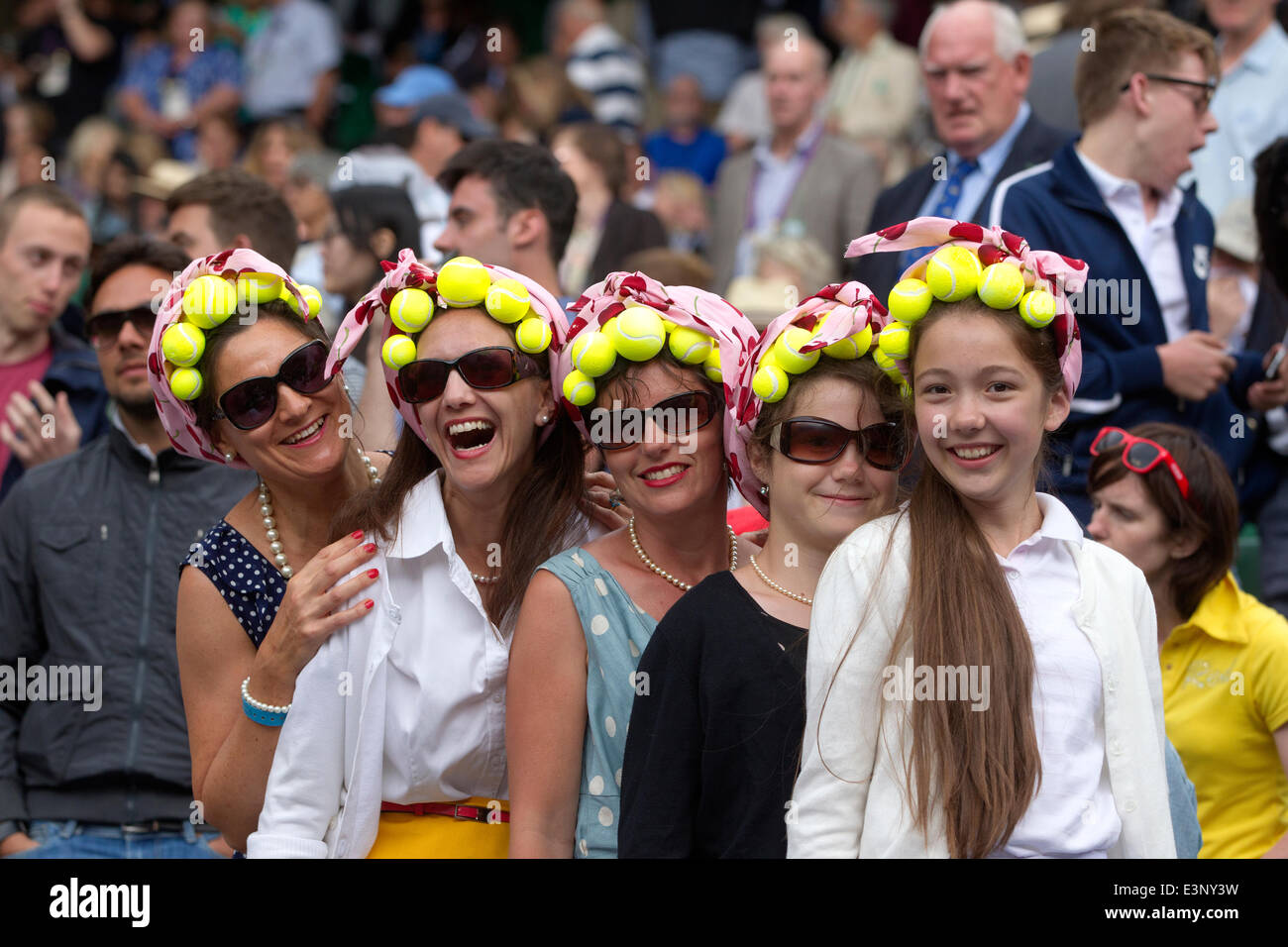 Wimbledon, London, UK. 26th June 2014. Picture shows tennis enthusiasts on Centre Court (left - right) Sarah Holmstrom, Wendy Evans, Jan Rossington, Zoe Rossington and Hannah Evans from Bristol enjoying this years Wimbledon Tennis Championships in Southwest London. Credit:  Clickpics/Alamy Live News Stock Photo