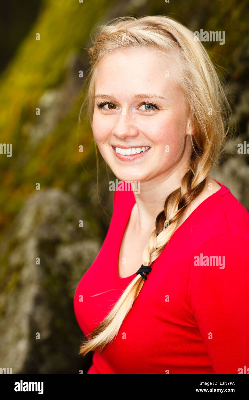 Young beautiful woman hiking in a forest Stock Photo - Alamy