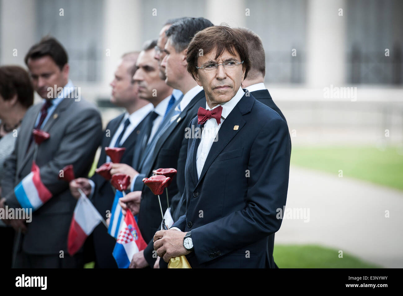 Ypres, Flanders, Belgium. 26th June, 2014. Belgium's Prime Minister Elio Di Rupo attends a ceremony marking the centenary of the outbreak of World War I, in Ypres, Belgium on 26.06.2014 During the war, hundreds of thousands of soldiers and civilians from all over the world lost their lives around the Belgian town of Ypres. To mark the occasion, the European Union donated a symbolic bench with bronzed copper plates reading the word 'Peace' in the EU's 24 official languages. Credit:  ZUMA Press, Inc./Alamy Live News Stock Photo