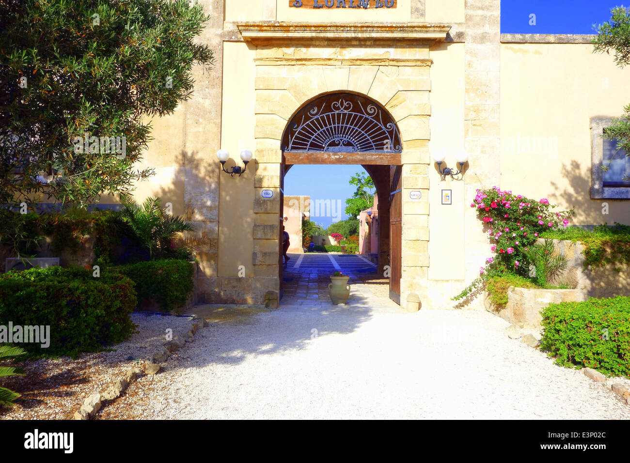 Welcoming entrance arch to Hotel Villa Giulia (Noto, Sicily) creates car free zone to hotel.  Villa Giulia is in the countryside Stock Photo