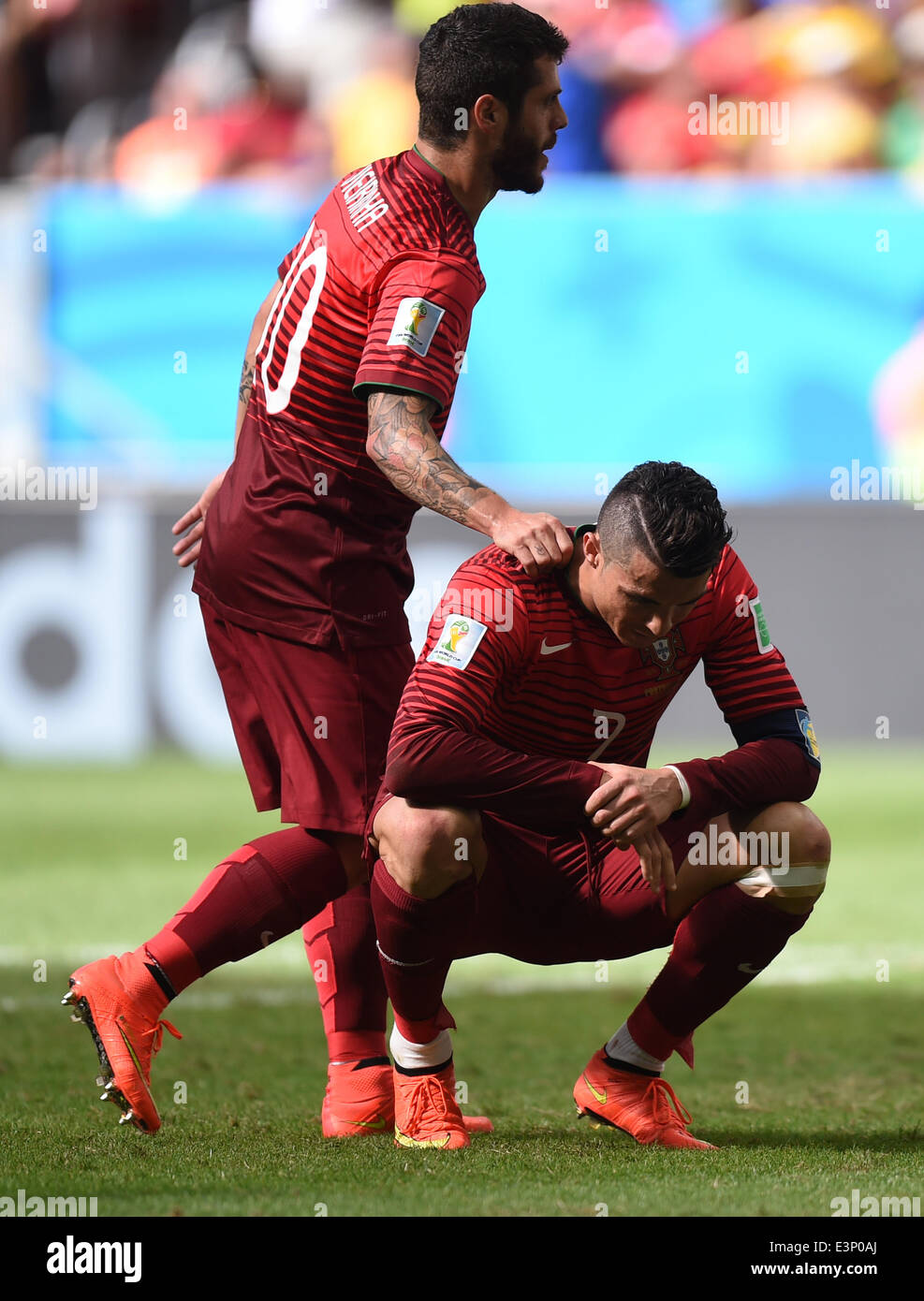 Brasilia, Brazil. 26th June, 2014. Cristiano Ronaldo (L) of Portugal reacts next to his team mate Vieirinha during the FIFA World Cup 2014 group G preliminary round match between Portugal and Ghana at the Estadio National Stadium in Brasilia, Brazil, on 26 June 2014 Credit: © dpa picture alliance/Alamy Live News  Stock Photo