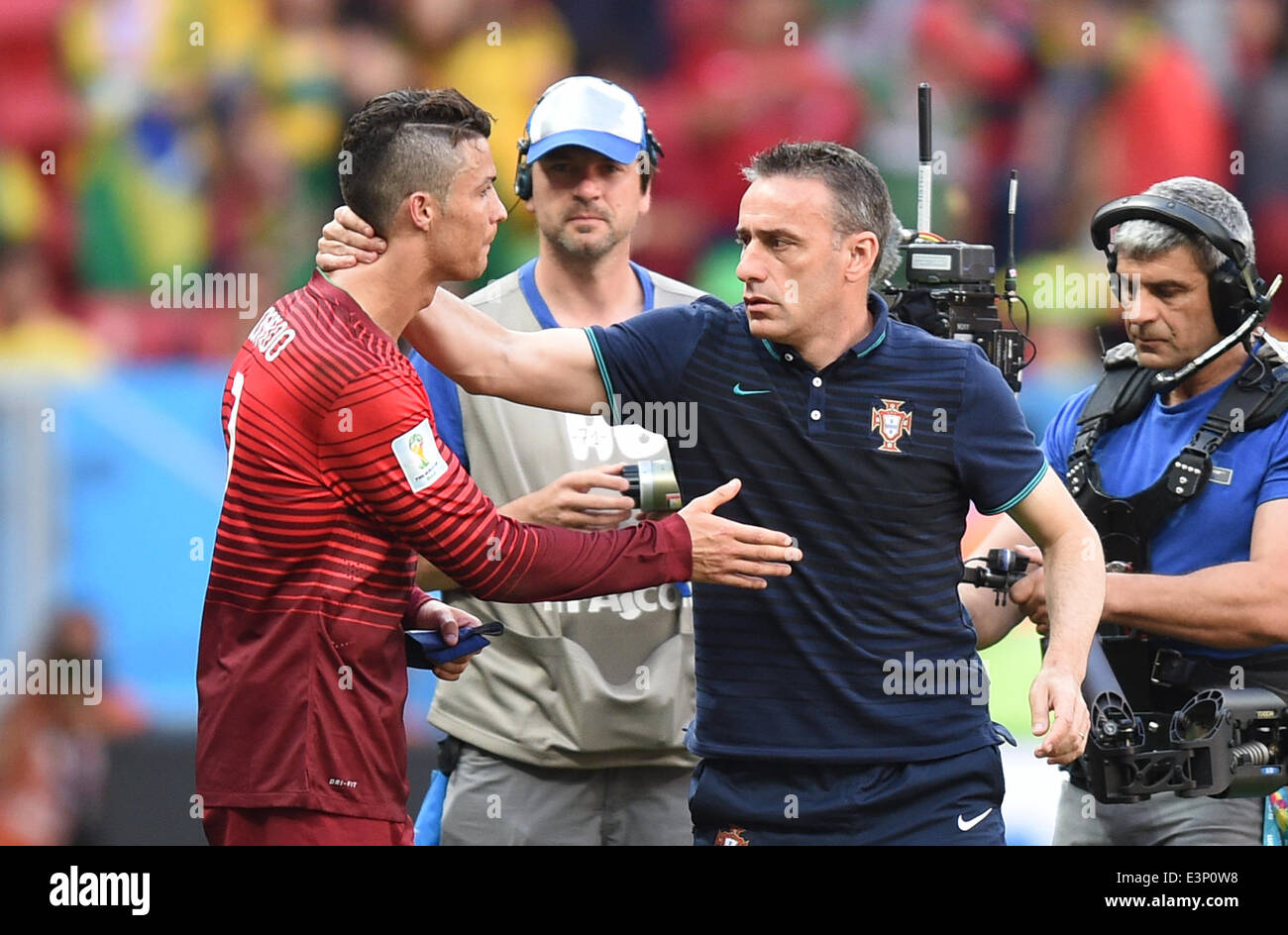 Brasilia, Brazil. 26th June, 2014. Cristiano Ronaldo (L) of Portugal hugs Portugal's head coach Paulo Bento after the FIFA World Cup 2014 group G preliminary round match between Portugal and Ghana at the Estadio National Stadium in Brasilia, Brazil, on 26 June 2014 Credit: © dpa picture alliance/Alamy Live News  Stock Photo