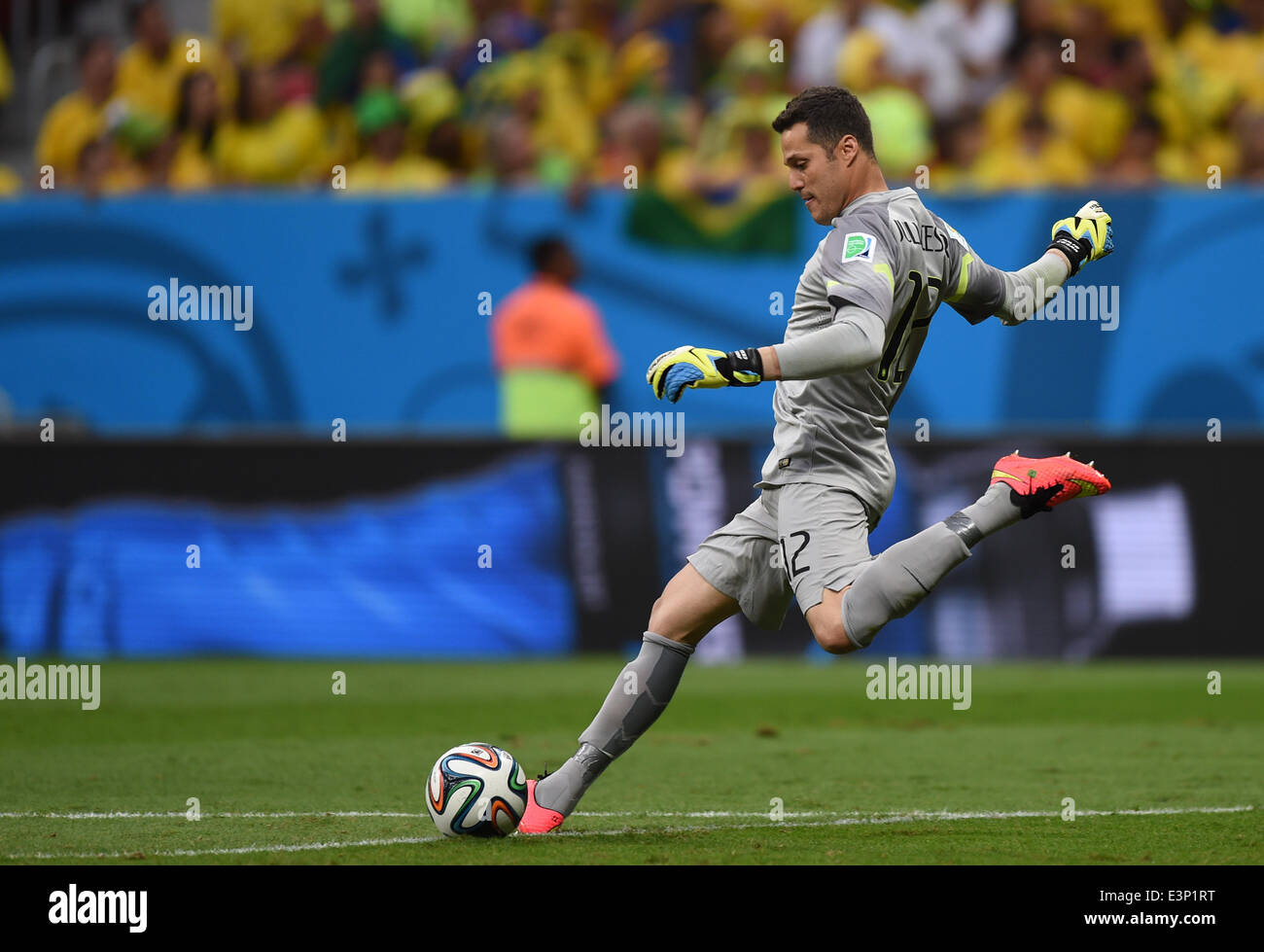 Brazil's goalkeeper Julio Cesar plays the ball during the FIFA World Cup 2014 group A preliminary round match between Cameroon and Brazil at the Estadio Nacional in Brasilia, Brazil, 23 June 2014. Photo: Marius Becker/dpa (RESTRICTIONS APPLY: Editorial Use Only, not used in association with any commercial entity - Images must not be used in any form of alert service or push service of any kind including via mobile alert services, downloads to mobile devices or MMS messaging - Images must appear as still images and must not emulate match action video footage - No alteration is made to, and no t Stock Photo