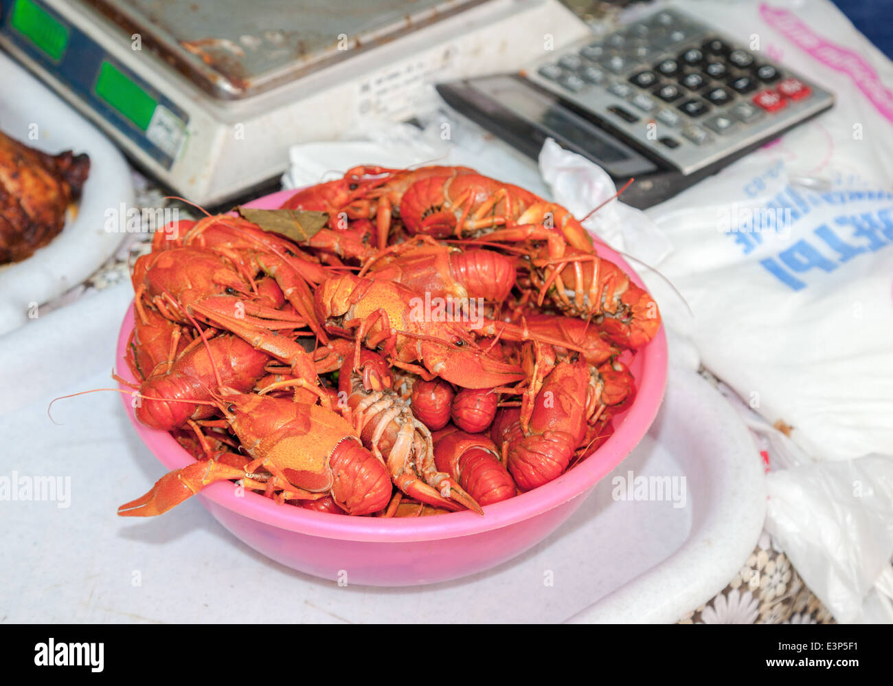 Plate with red boiled crawfish on a table close up Stock Photo