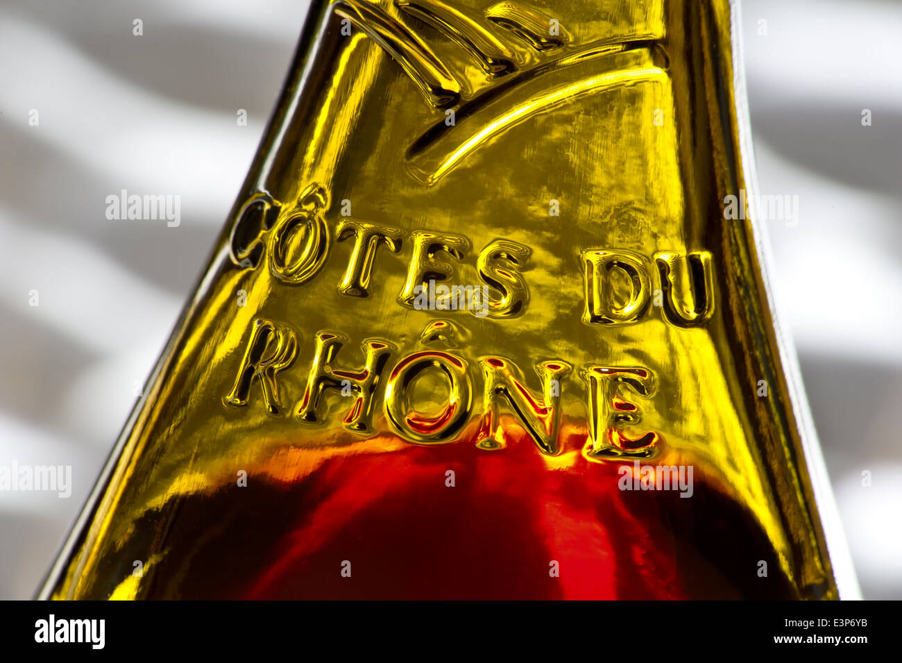 Close view on the glass relief label on a bottle of French Cotes du Rhone red wine Stock Photo