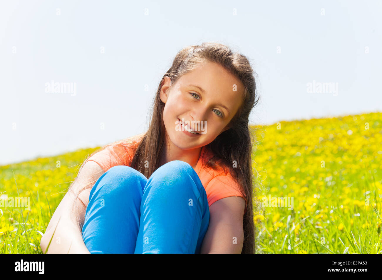 Portrait of beautiful girl sitting in the park Stock Photo - Alamy