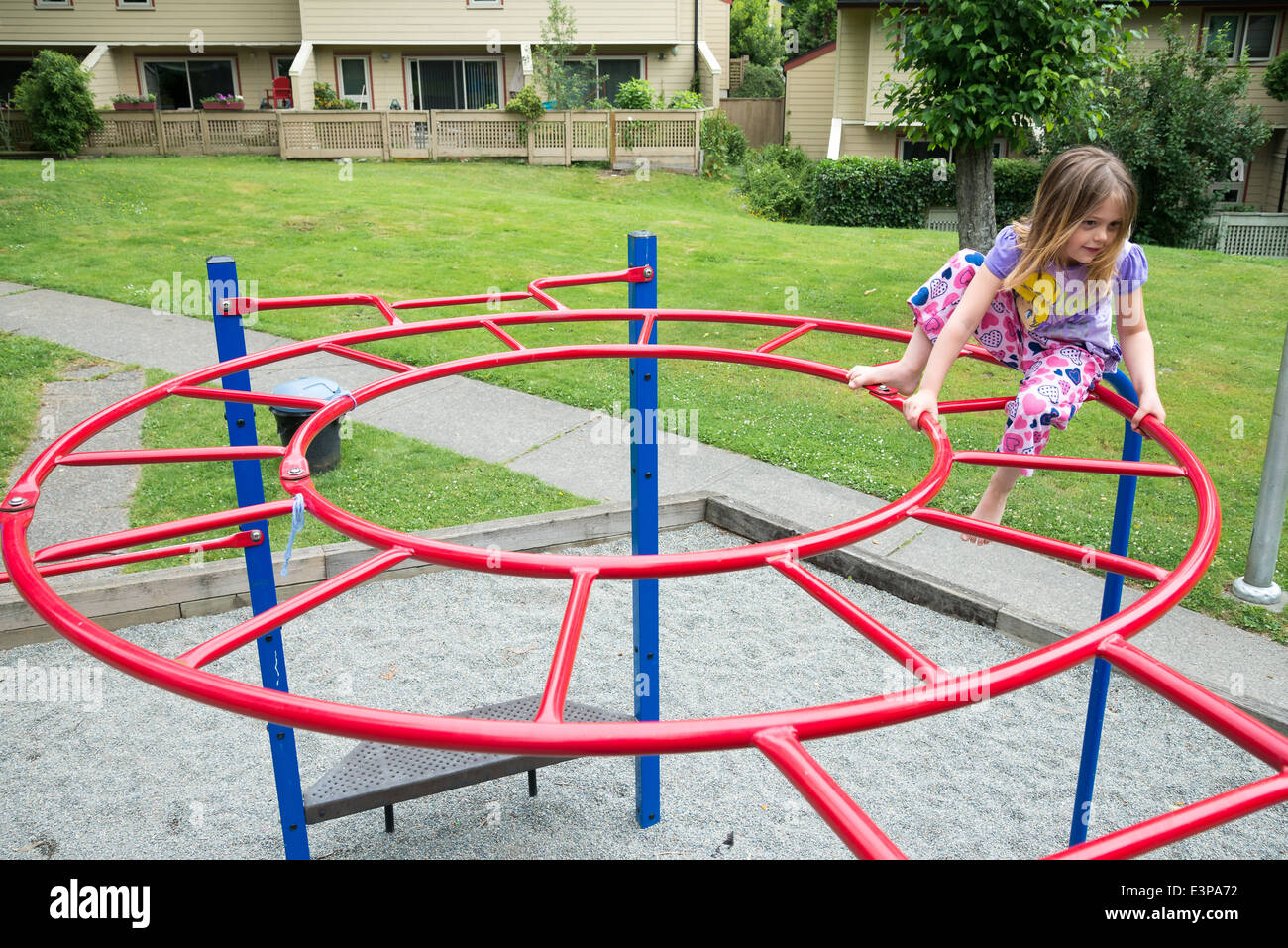 Playground circle circular climbing bars child bars child girl playground hires stock