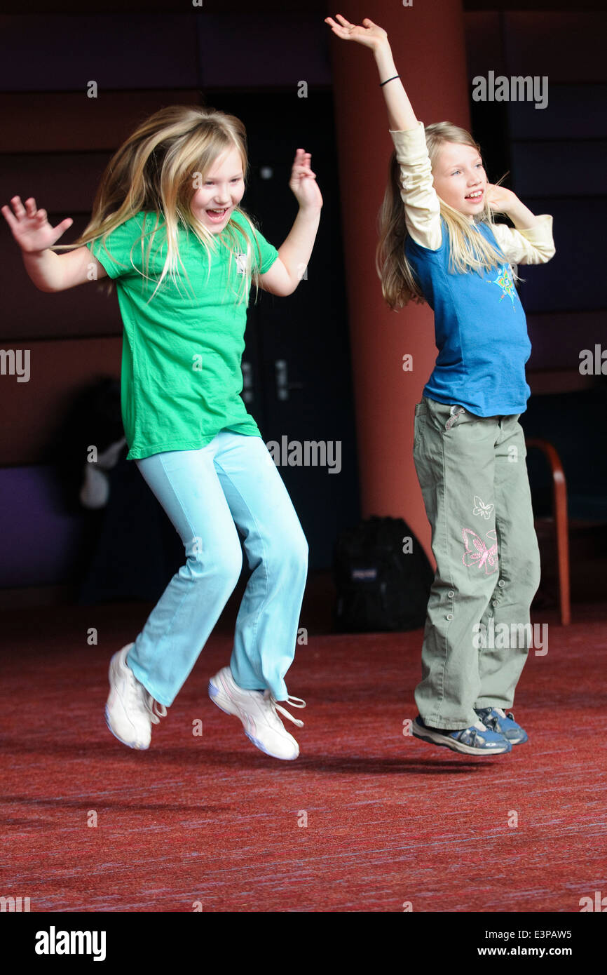 Happy girls jumping in hi-res stock photography and images - Alamy