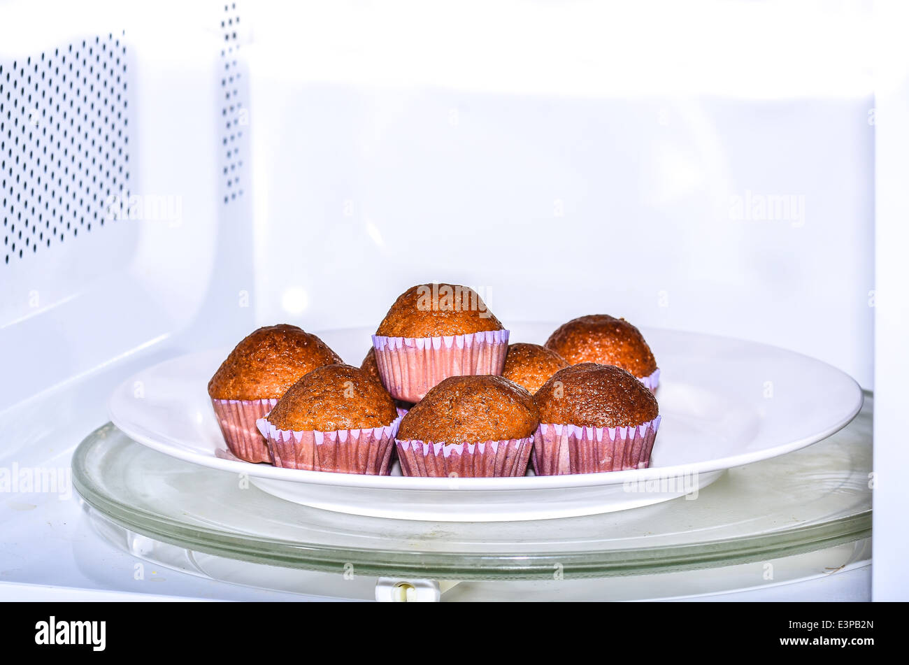 baking muffins in oven Stock Photo Alamy