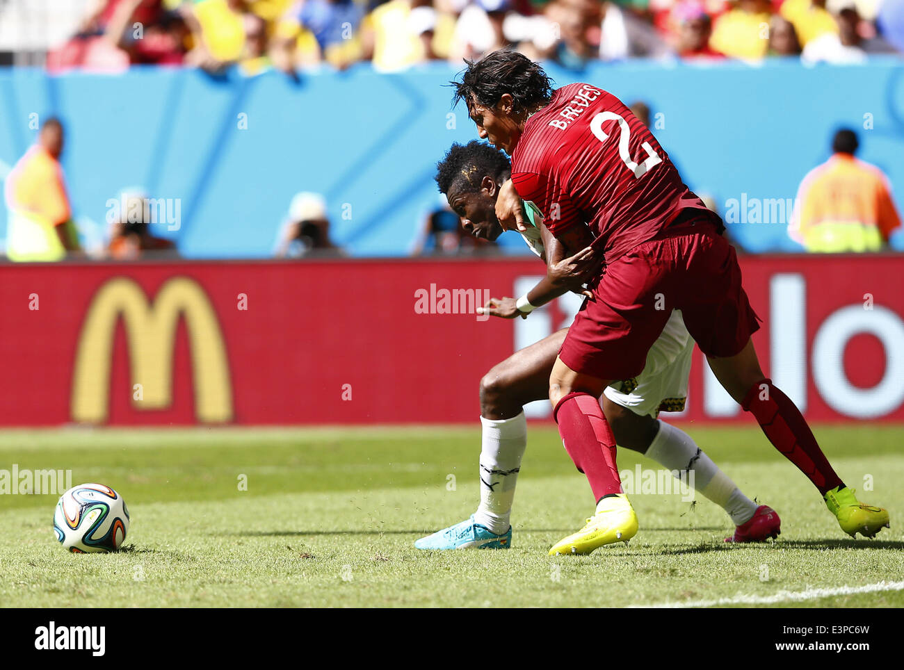 Brasilia, Brazil. 26th June, 2014. Portugal's Bruno Alves (R) vies for the ball during a Group G match between Portugal and Ghana of 2014 FIFA World Cup at the Estadio Nacional Stadium in Brasilia, Brazil, June 26, 2014. Credit:  Liu Bin/Xinhua/Alamy Live News Stock Photo