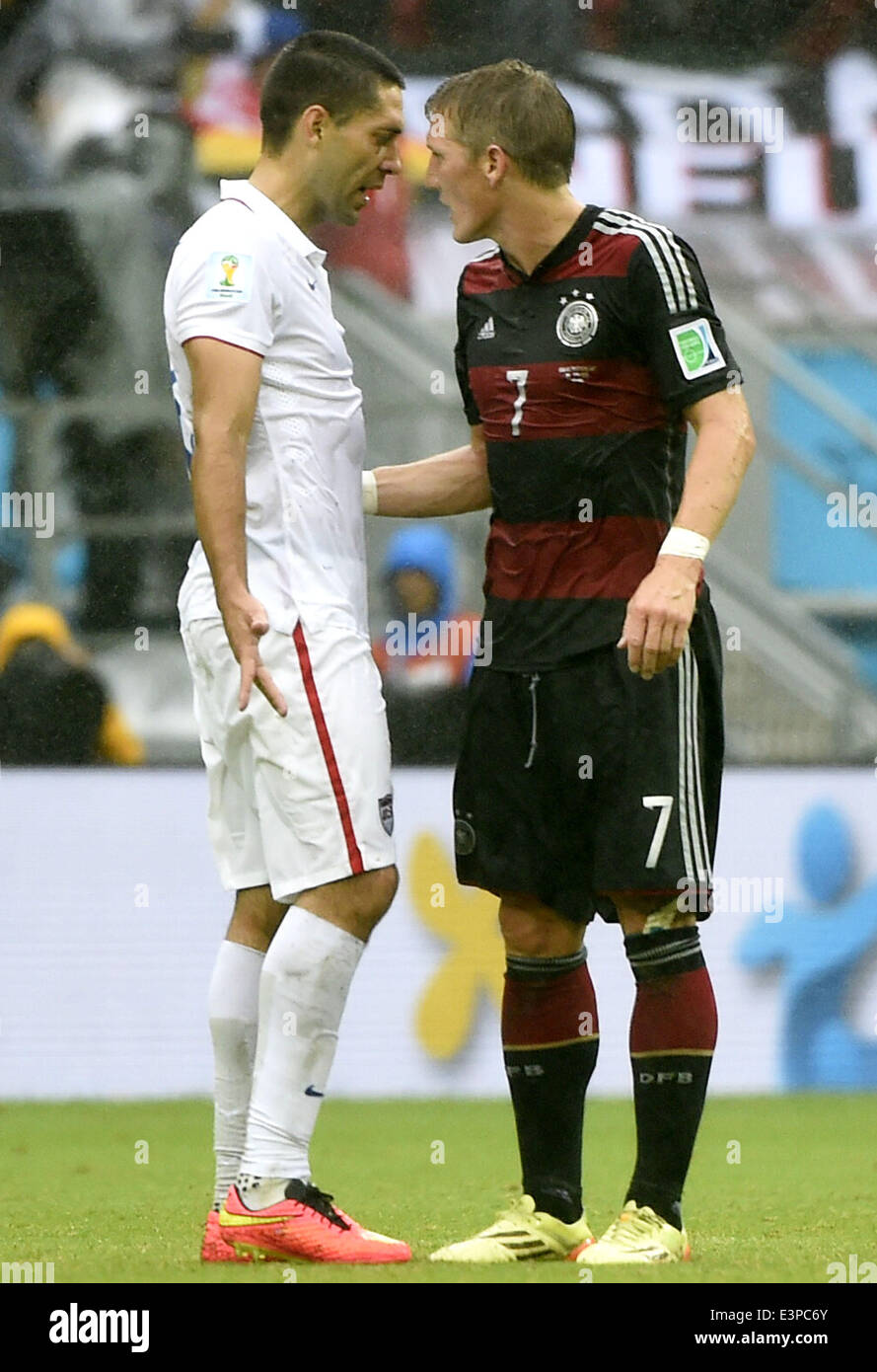 Recife, Brazil. 26th June, 2014. Clint Dempsey of the U.S. (L) argues with Germany's Bastian Schweinsteiger during a Group G match between the U.S. and Germany of 2014 FIFA World Cup at the Arena Pernambuco Stadium in Recife, Brazil, on June 26, 2014. Credit:  Lui Siu Wai/Xinhua/Alamy Live News Stock Photo