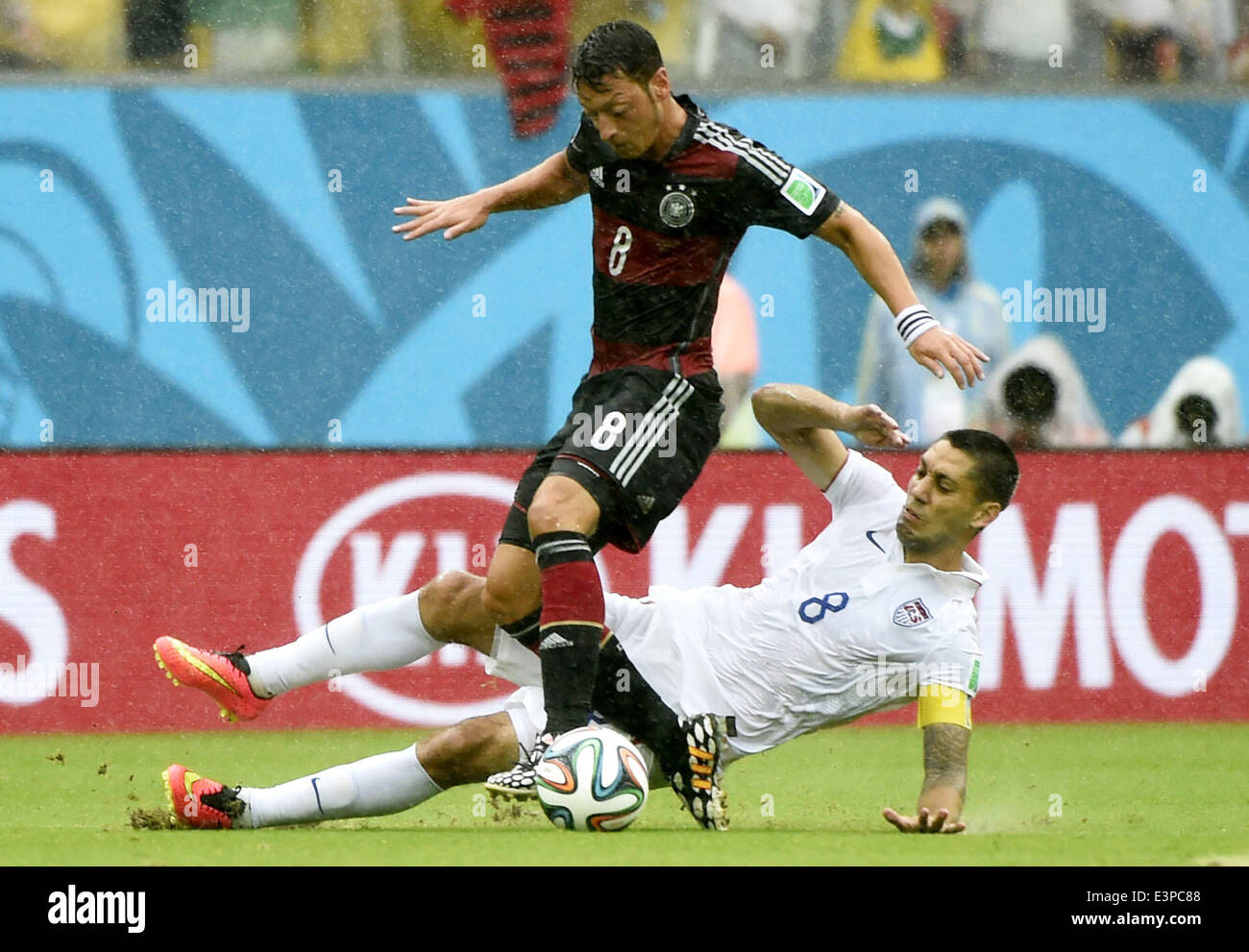 Recife, Brazil. 26th June, 2014. Clint Dempsey of the U.S. (R) vies with Germany's Mesut Ozil during a Group G match between the U.S. and Germany of 2014 FIFA World Cup at the Arena Pernambuco Stadium in Recife, Brazil, on June 26, 2014. Credit:  Lui Siu Wai/Xinhua/Alamy Live News Stock Photo
