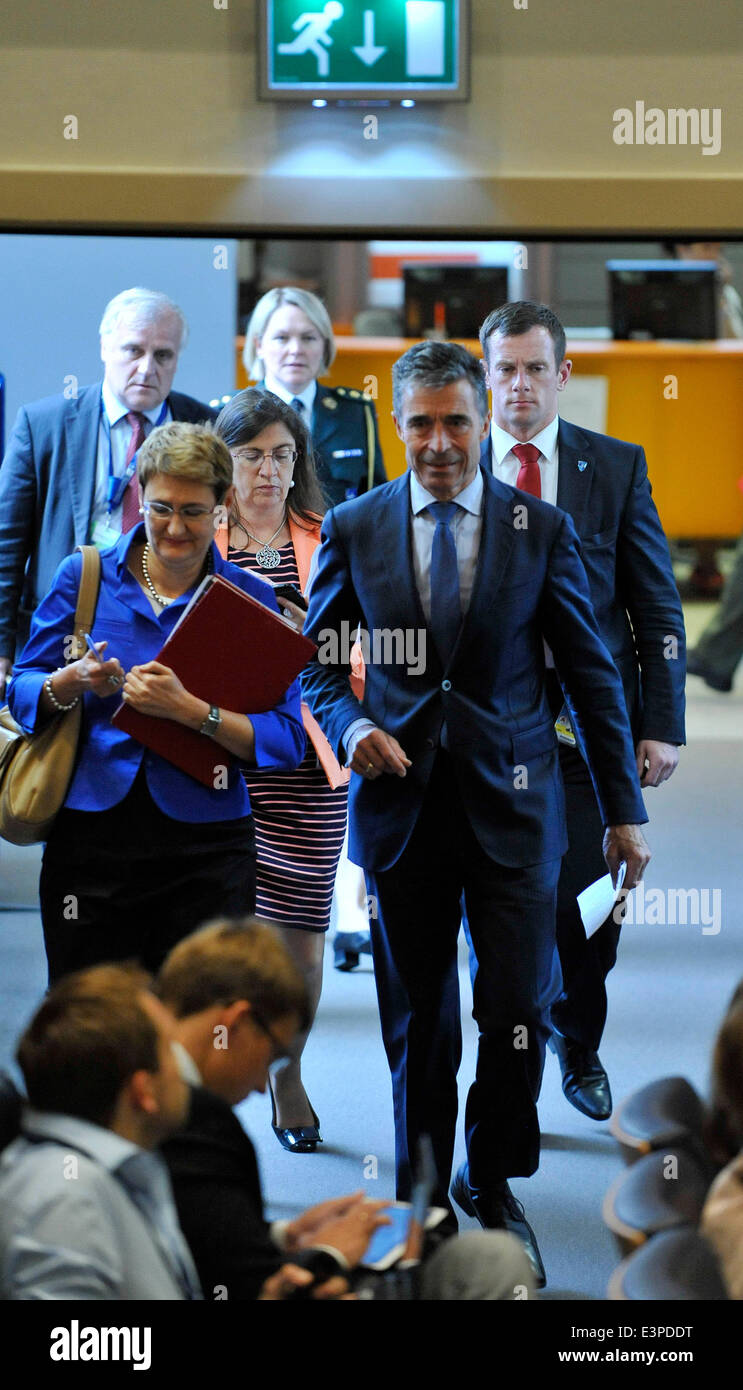 Brussels, Brussels. 25th June, 2014. NATO Secretary General Anders Fogh Rasmussen (R, front) arrives at a press conference during NATO Foreign Ministers Meetings at its headquarters in Brussels, capital of Brussels, June 25, 2014. © Ye Pingfan/Xinhua/Alamy Live News Stock Photo