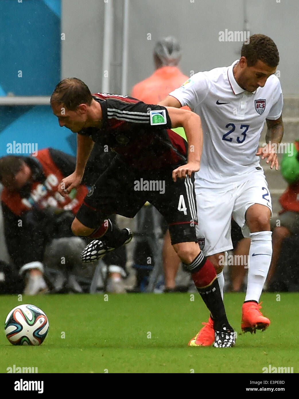 Recife, Brazil. 26th June, 2014. Germany's Benedikt Howedes (L) vies with Fabian Johnson of the U.S. during a Group G match between the U.S. and Germany of 2014 FIFA World Cup at the Arena Pernambuco Stadium in Recife, Brazil, on June 26, 2014. Credit:  Guo Yong/Xinhua/Alamy Live News Stock Photo