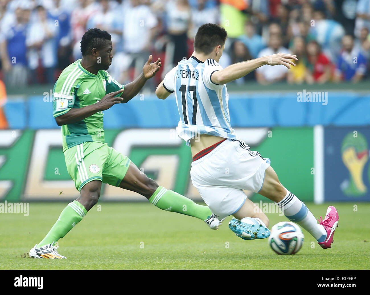 Porto Alegre, Brazil. 25th June, 2014. Argentina's Federico Fernandez (R) competes during a Group F match between Nigeria and Argentina of 2014 FIFA World Cup at the Estadio Beira-Rio Stadium in Porto Alegre, Brazil, on June 25, 2014. © Chen Jianli/Xinhua/Alamy Live News Stock Photo