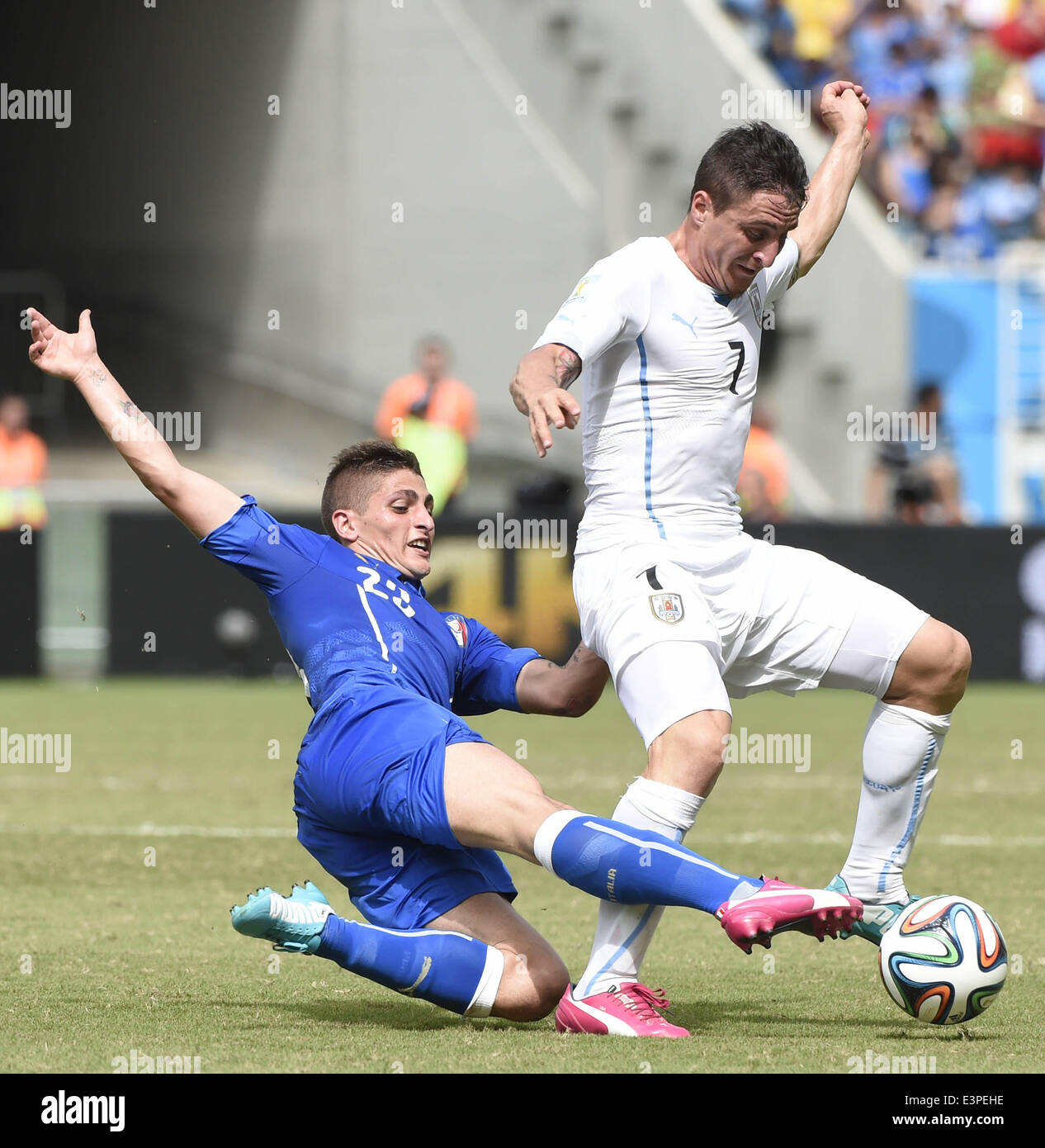 Natal, Brazil. 24th June, 2014. Italy's Marco Verratti vies with Uruguay's Cristian Rodriguez during a Group D match between Italy and Uruguay of 2014 FIFA World Cup at the Estadio das Dunas Stadium in Natal, Brazil, June 24, 2014. © Lui Siu Wai/Xinhua/Alamy Live News Stock Photo