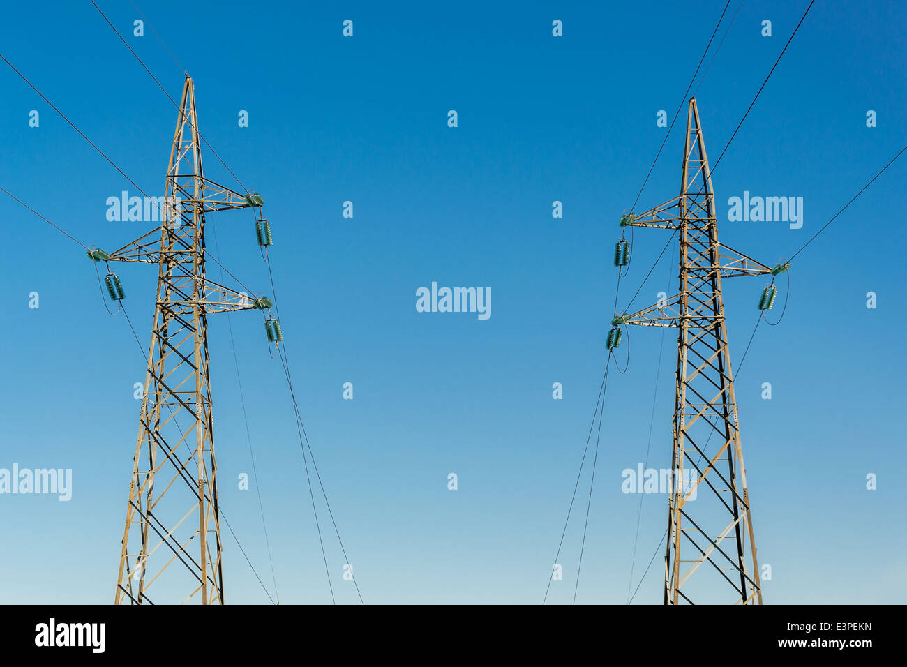 High-voltage electricity pylons, view from below Stock Photo