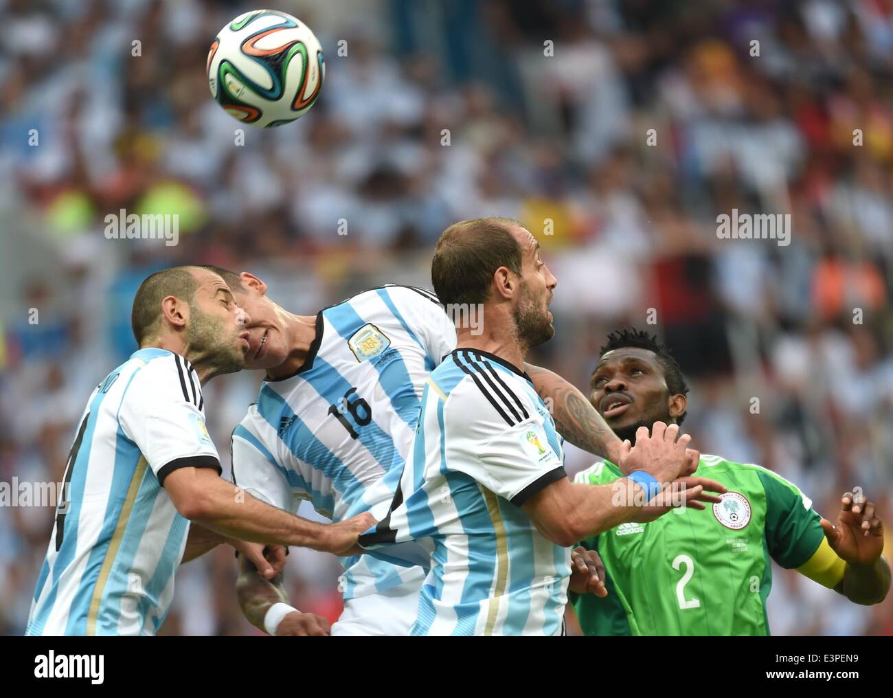 Porto Alegre, Brazil. 25th June, 2014. Nigeria's Joseph Yobo (1st R) competes with Argentina's players during a Group F match between Nigeria and Argentina of 2014 FIFA World Cup at the Estadio Beira-Rio Stadium in Porto Alegre, Brazil, on June 25, 2014. © Li Ga/Xinhua/Alamy Live News Stock Photo