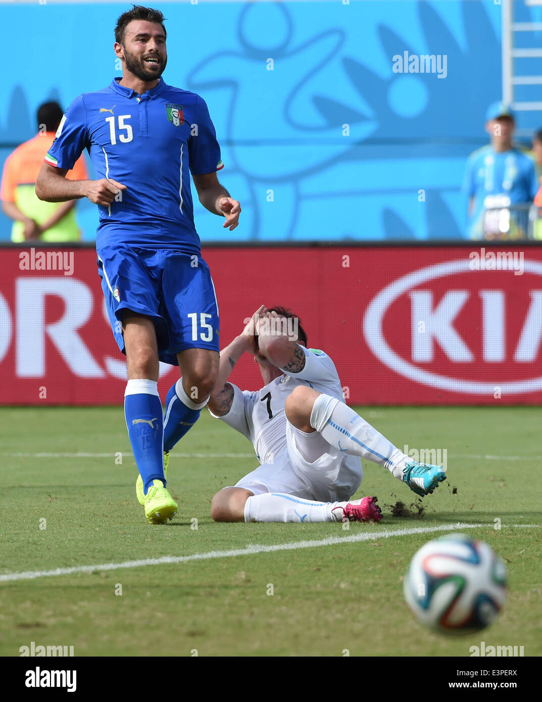 Natal, Brazil. 24th June, 2014. Uruguay's Cristian Rodriguez falls down during a Group D match between Italy and Uruguay of 2014 FIFA World Cup at the Estadio das Dunas Stadium in Natal, Brazil, June 24, 2014. © Guo Yong/Xinhua/Alamy Live News Stock Photo
