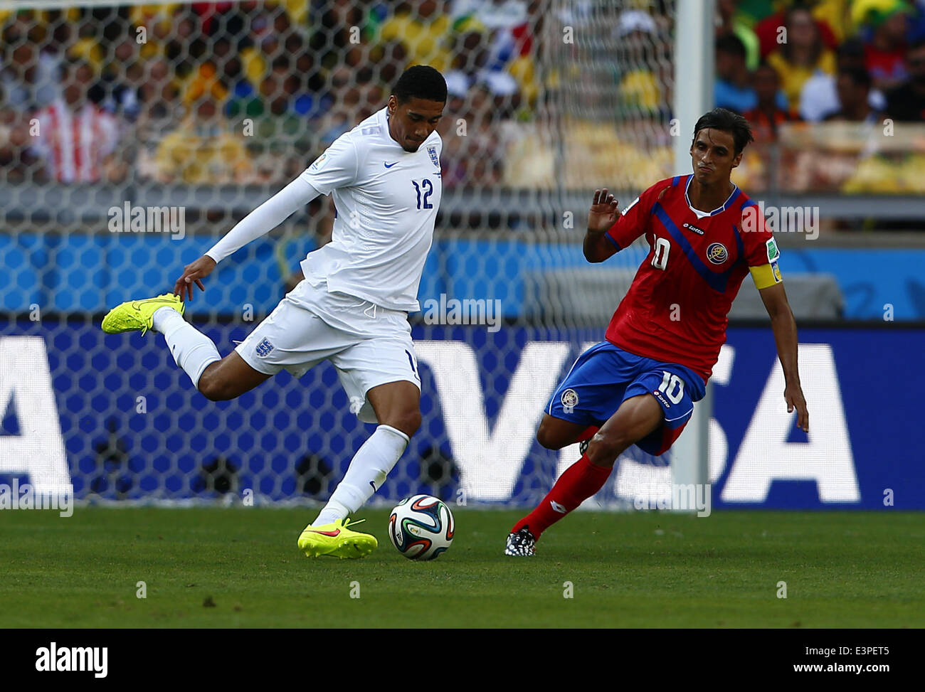 Belo Horizonte, Brazil. 24th June, 2014. England's Chris Smalling (L) vies with Costa Rica's Bryan Ruiz during a Group D match between Costa Rica and England of 2014 FIFA World Cup at the Estadio Mineirao Stadium in Belo Horizonte, Brazil, on June 24, 2014. England drew 0-0 with Costa Rica on Tuesday. © Liu Bin/Xinhua/Alamy Live News Stock Photo