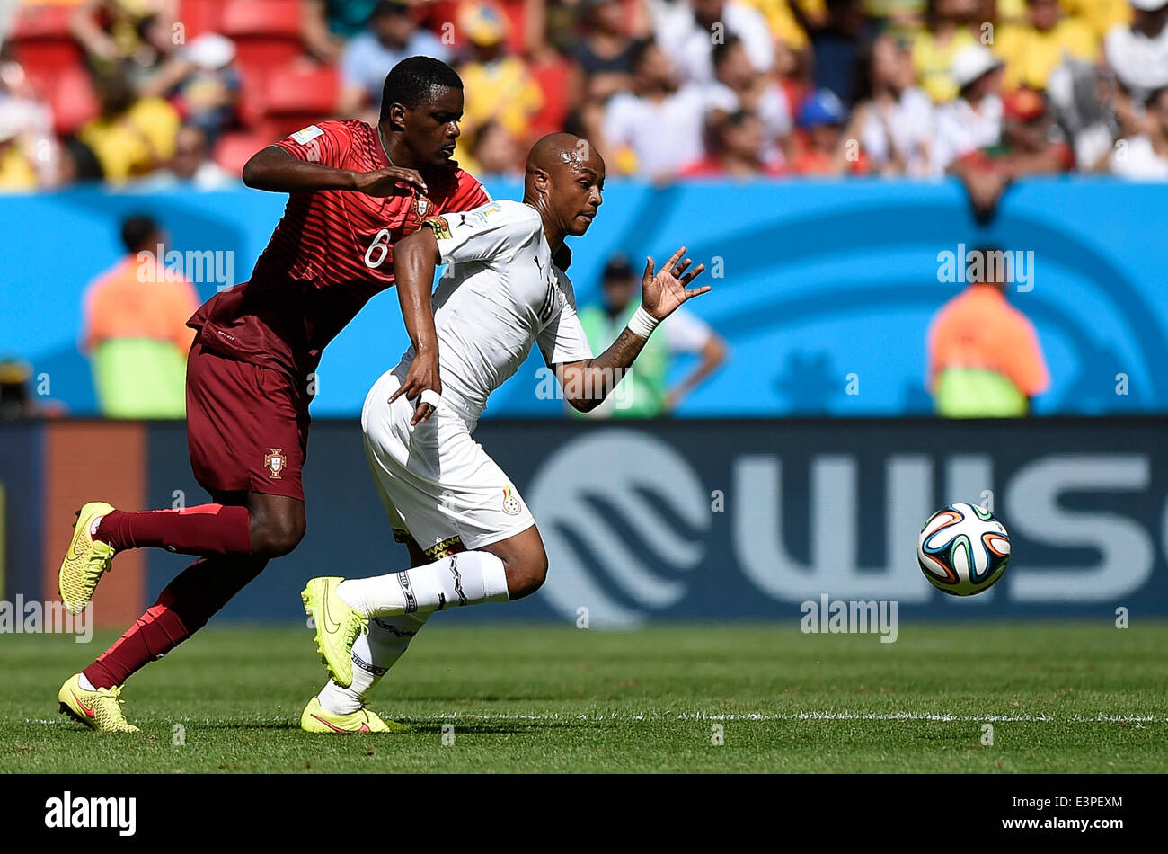 Brasilia, Brazil. 26th June, 2014. Portugal's William Carvalho (L) competes with Gana's Andre Ayew during a Group G match between Portugal and Ghana of 2014 FIFA World Cup at the Estadio Nacional Stadium in Brasilia, Brazil, June 26, 2014. Portugal won 2-1 over Ghana on Thursday. © Qi Heng/Xinhua/Alamy Live News Stock Photo