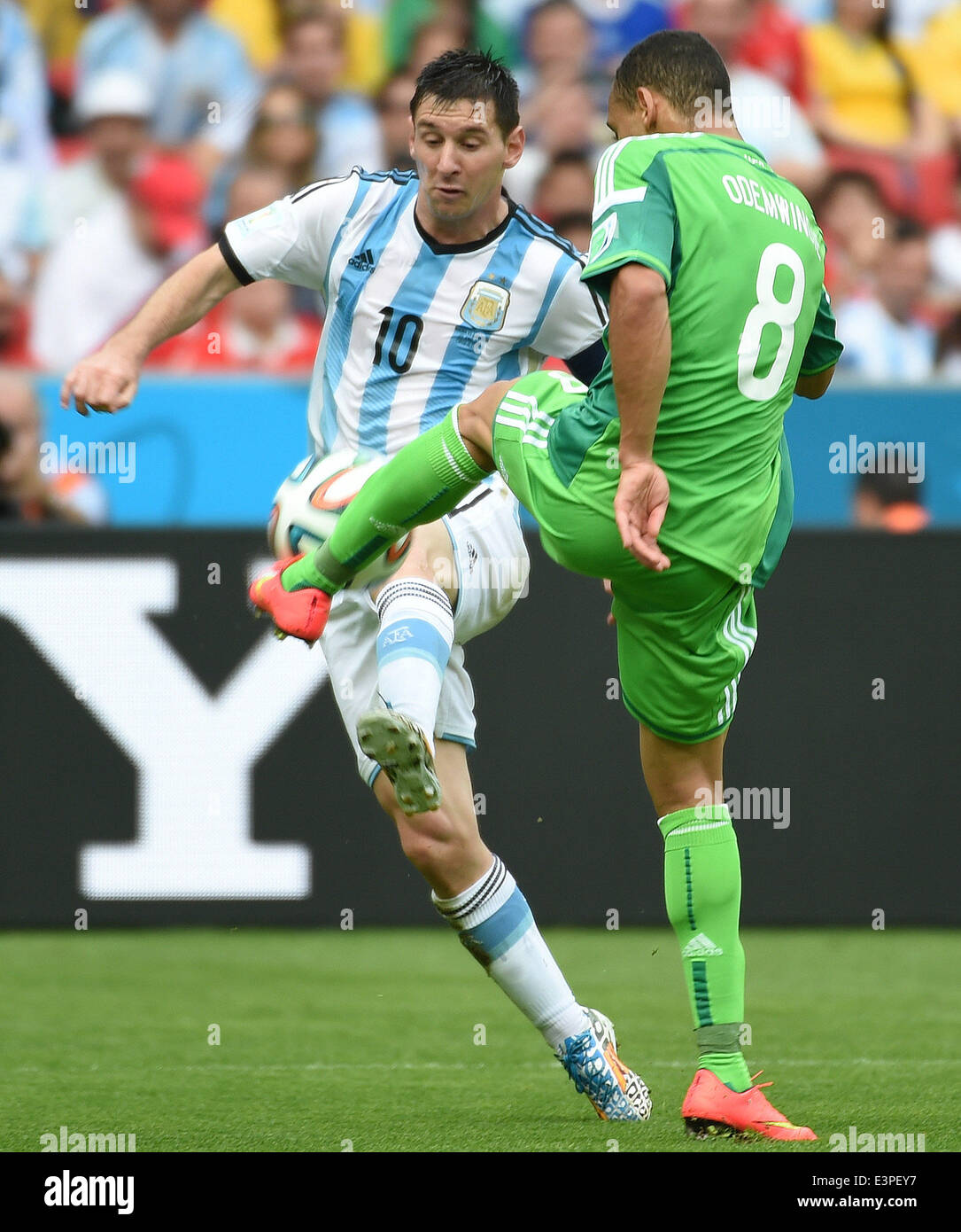 Porto Alegre, Brazil. 25th June, 2014. Argentina's Lionel Messi (L) vies with Nigeria's Peter Osaze Odemwingie during a Group F match between Nigeria and Argentina of 2014 FIFA World Cup at the Estadio Beira-Rio Stadium in Porto Alegre, Brazil, on June 25, 2014. Argentina won 3-2 over Nigeria on Wednesday. © Li Ga/Xinhua/Alamy Live News Stock Photo