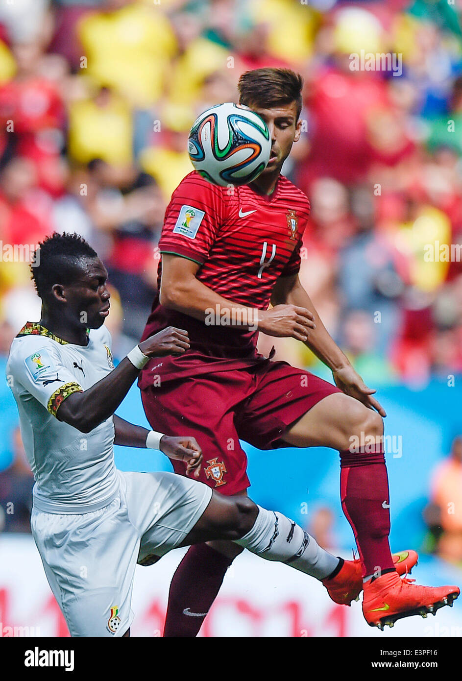 Brasilia, Brazil. 26th June, 2014. Portugal's Miguel Veloso (L) competes during a Group G match between Portugal and Ghana of 2014 FIFA World Cup at the Estadio Nacional Stadium in Brasilia, Brazil, June 26, 2014. Portugal won 2-1 over Ghana on Thursday. © Qi Heng/Xinhua/Alamy Live News Stock Photo