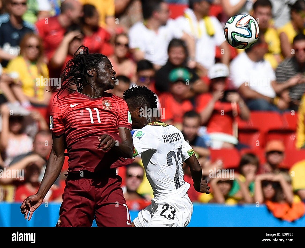 Brasilia, Brazil. 26th June, 2014. Portugal's Eder (L) competes for a header with Ghana's Harrison Afful during a Group G match between Portugal and Ghana of 2014 FIFA World Cup at the Estadio Nacional Stadium in Brasilia, Brazil, June 26, 2014. Portugal won 2-1 over Ghana on Thursday. © Qi Heng/Xinhua/Alamy Live News Stock Photo