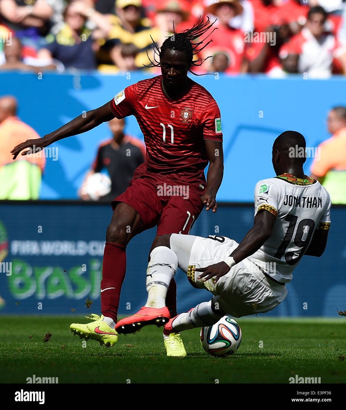 Brasilia, Brazil. 26th June, 2014. Portugal's Eder (L) competes with Ghana's Jonathan Mensah during a Group G match between Portugal and Ghana of 2014 FIFA World Cup at the Estadio Nacional Stadium in Brasilia, Brazil, June 26, 2014. Portugal won 2-1 over Ghana on Thursday. © Qi Heng/Xinhua/Alamy Live News Stock Photo