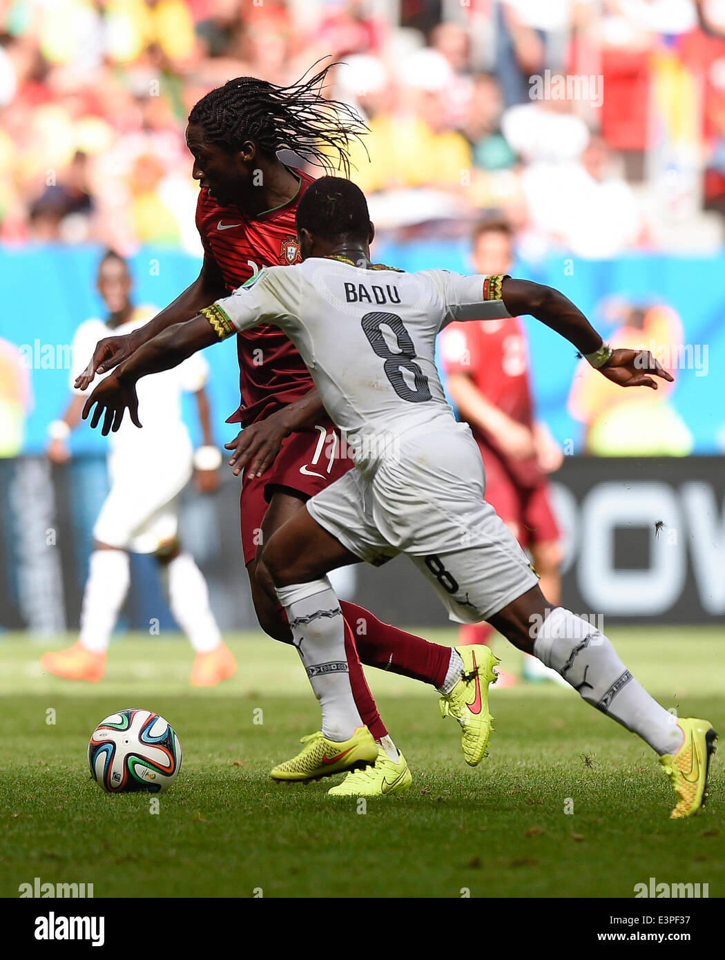 Brasilia, Brazil. 26th June, 2014. Portugal's Eder (L) competes with Ghana's Emmanuel Agyemang-Badu during a Group G match between Portugal and Ghana of 2014 FIFA World Cup at the Estadio Nacional Stadium in Brasilia, Brazil, June 26, 2014. Portugal won 2-1 over Ghana on Thursday. © Qi Heng/Xinhua/Alamy Live News Stock Photo