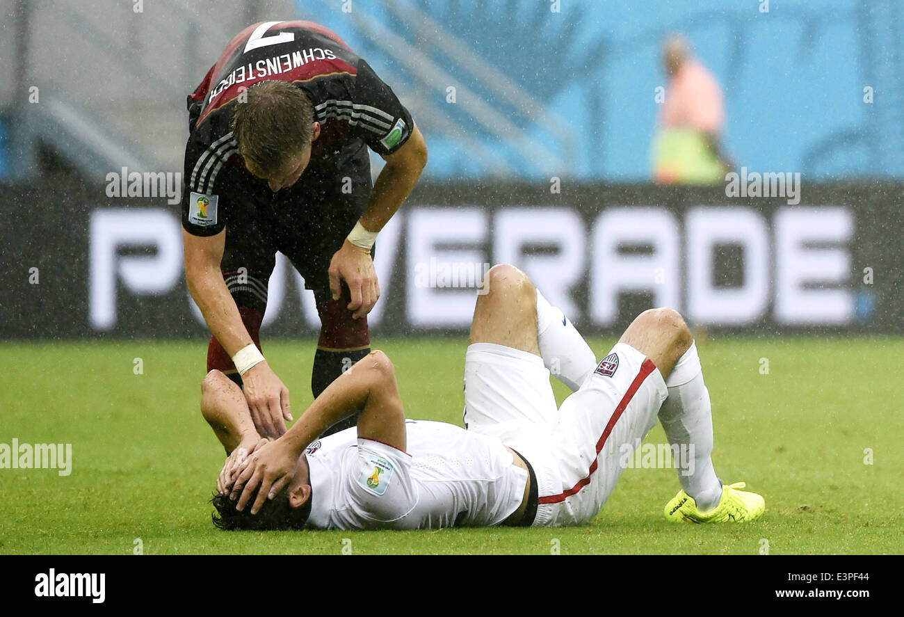Recife, Brazil. 26th June, 2014. Germany's Bastian Schweinsteiger (L) comforts Alejandro Bedoya of the U.S. during a Group G match between the U.S. and Germany of 2014 FIFA World Cup at the Arena Pernambuco Stadium in Recife, Brazil, on June 26, 2014. Germany won 1-0 over the U.S. on Thursday. Germany and the U.S. enter Round of 16 from Group G. Credit:  Lui Siu Wai/Xinhua/Alamy Live News Stock Photo