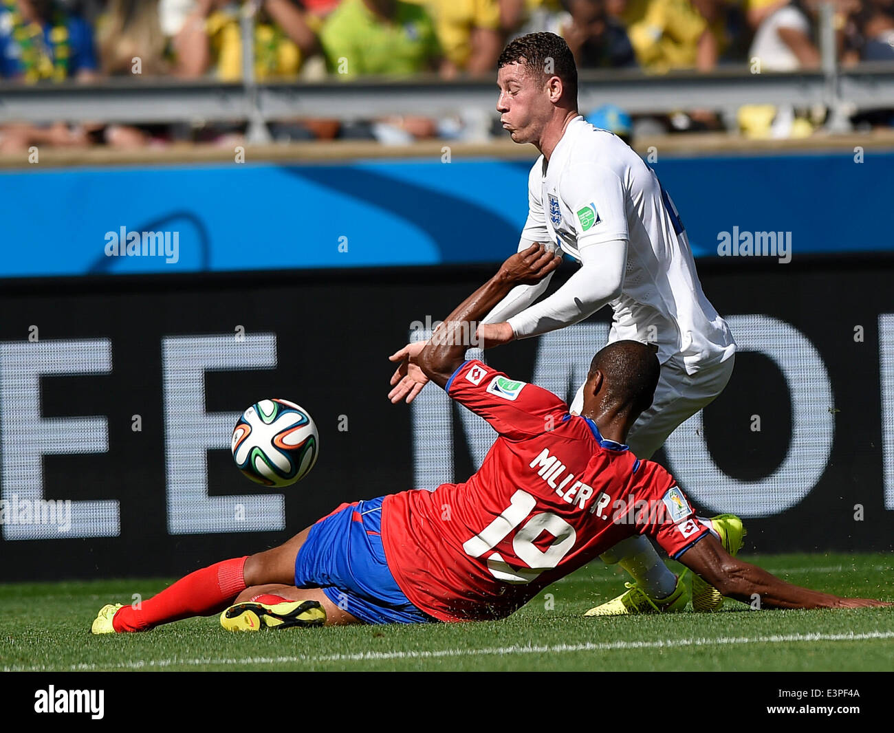 Belo Horizonte, Brazil. 24th June, 2014. England's Ross Barkely (R) vies with Costa Rica's Roy Miller during a Group D match between Costa Rica and England of 2014 FIFA World Cup at the Estadio Mineirao Stadium in Belo Horizonte, Brazil, on June 24, 2014. England drew 0-0 with Costa Rica on Tuesday. © Qi Heng/Xinhua/Alamy Live News Stock Photo